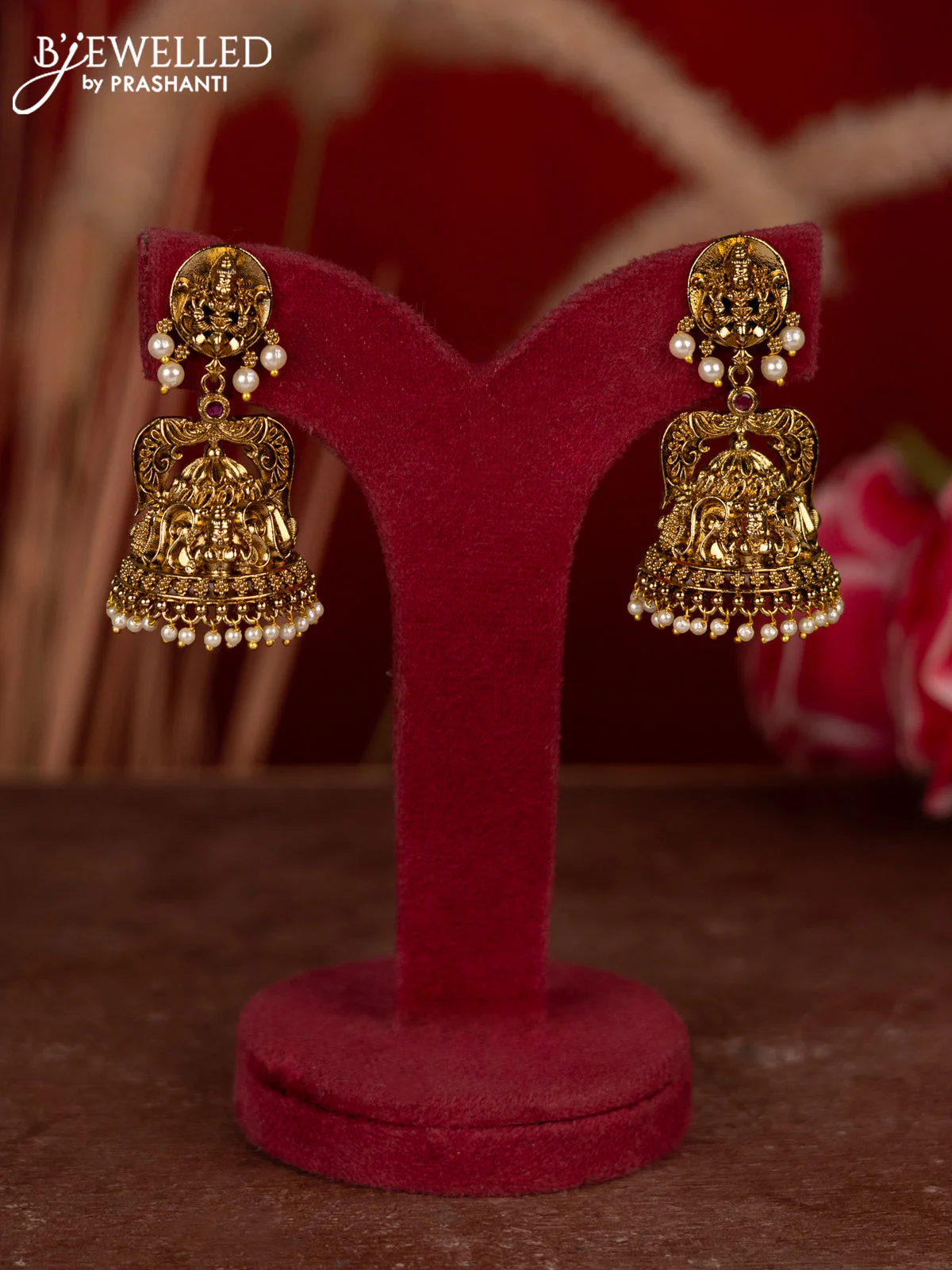 Antique jhumkas lakshmi design with ruby stones and pearl hangings