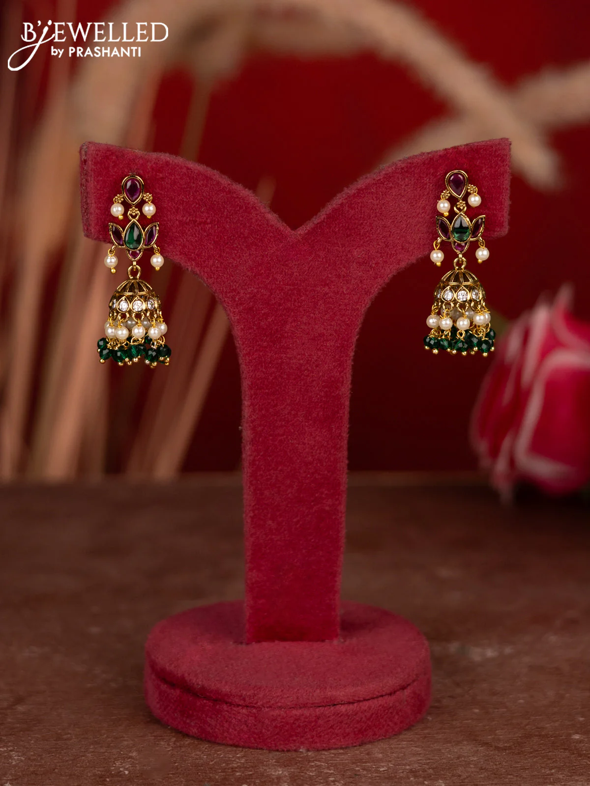 Antique jhumkas lotus design with kemp & cz stones and pearl & green beads hangings
