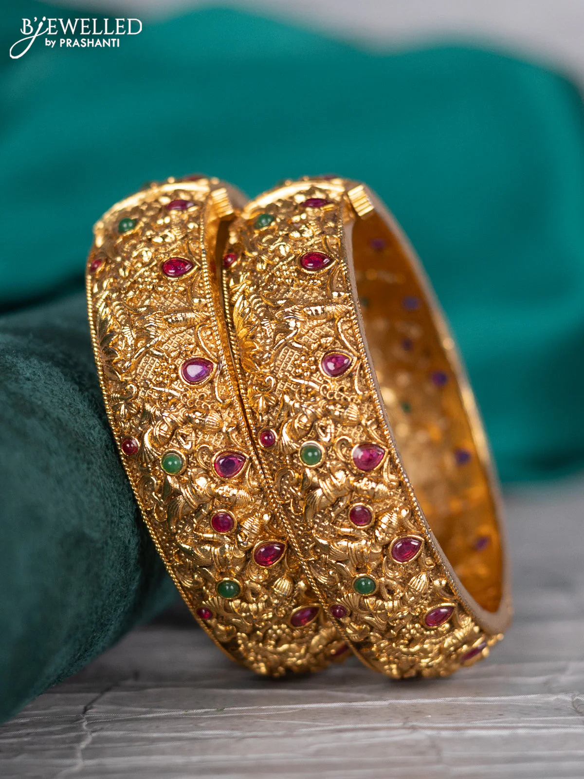 Antique screw type bangle lakshmi design with kemp stones