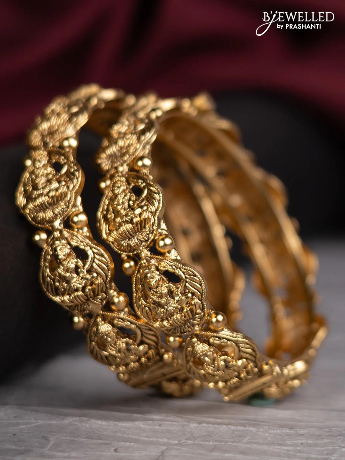 Antique screw type bangles with lakshmi design