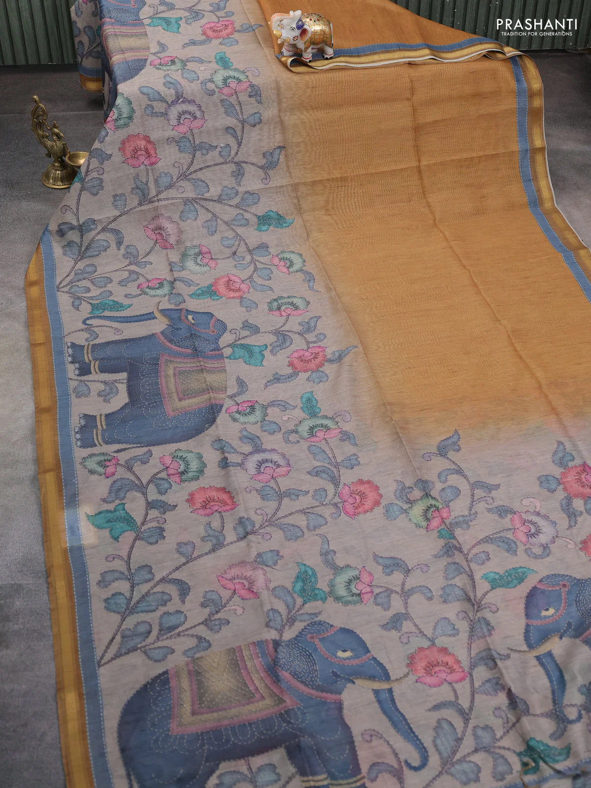 Art linen saree mustard shade and pastel grey with allover kalamkari prints and zari woven border - Image 2