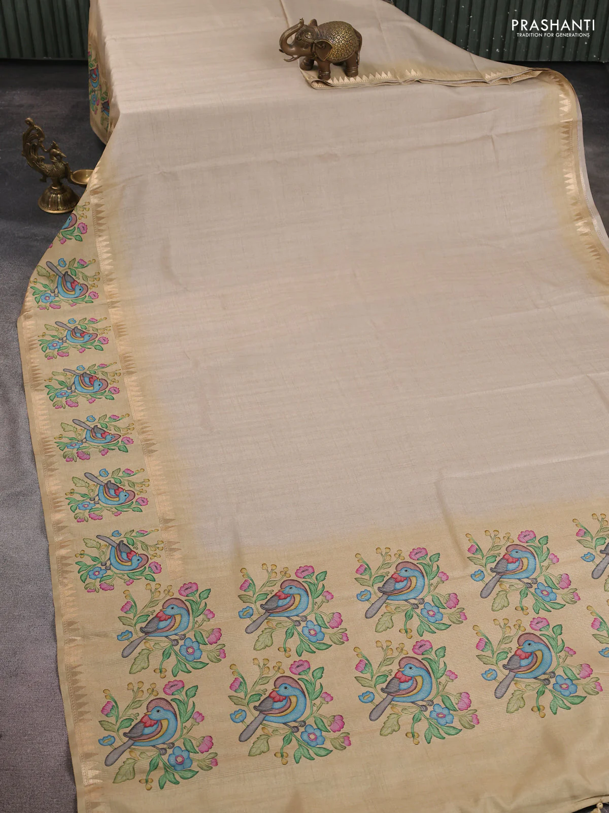 Art tussar saree beige and sandal with plain body and tanjore printed border - Image 2