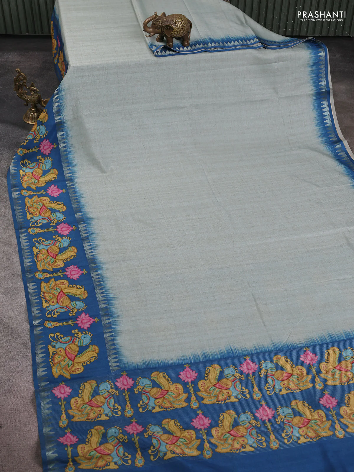 Art tussar saree pastel blue and peacock blue with plain body and tanjore printed border - Image 2