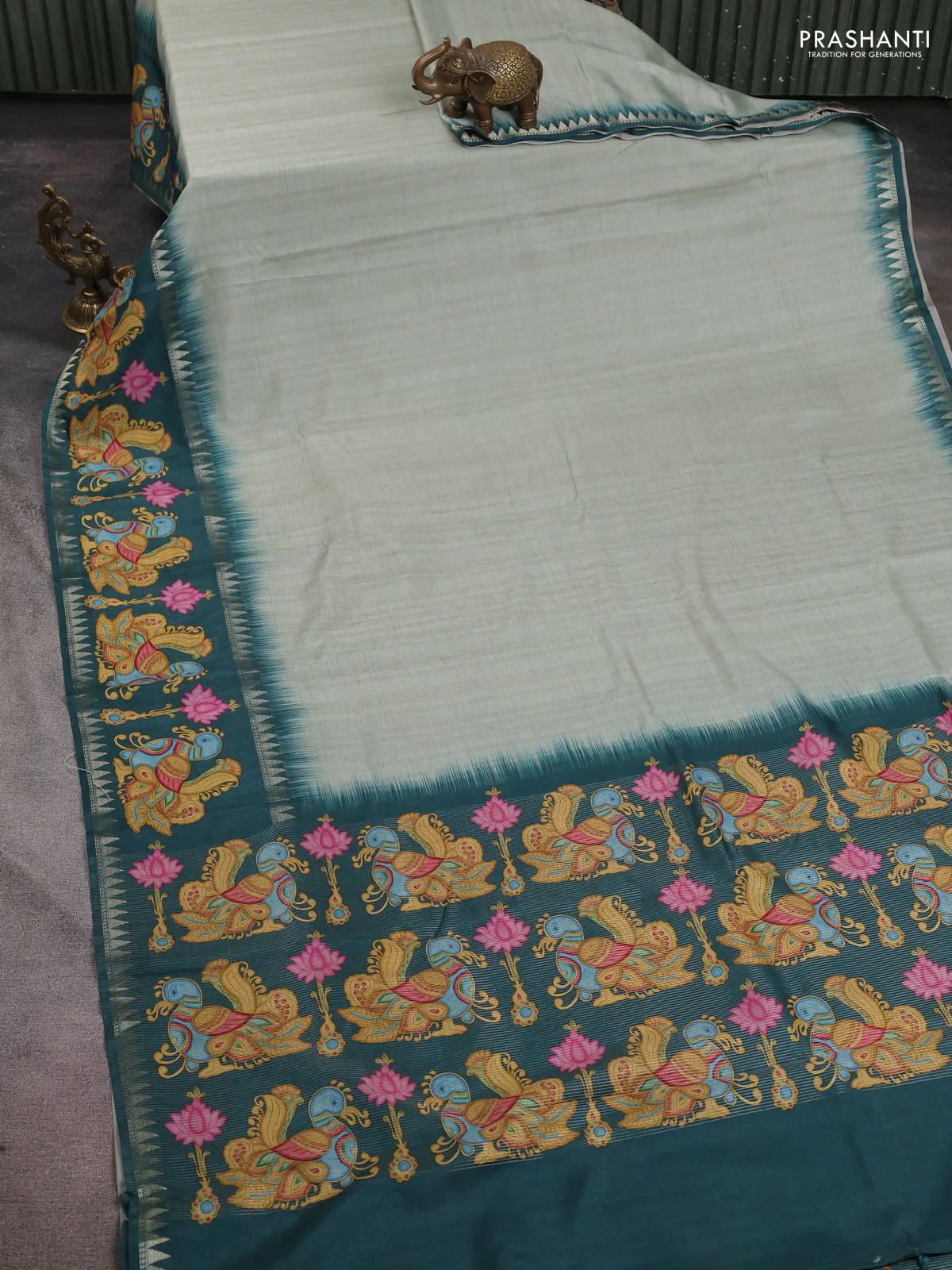 Art tussar saree pastel green and peacock green with plain body and tanjore printed border - Image 2