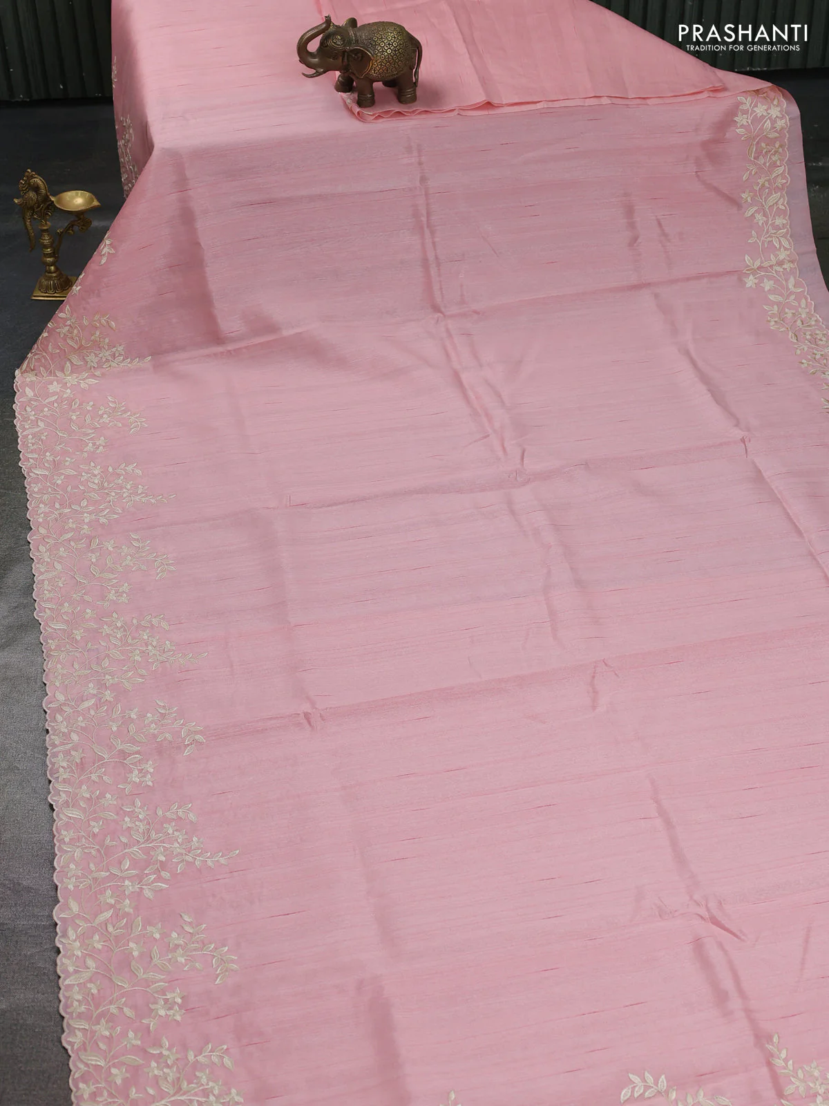 Art tussar saree peach shade with plain body and floral embroidery border - Image 2