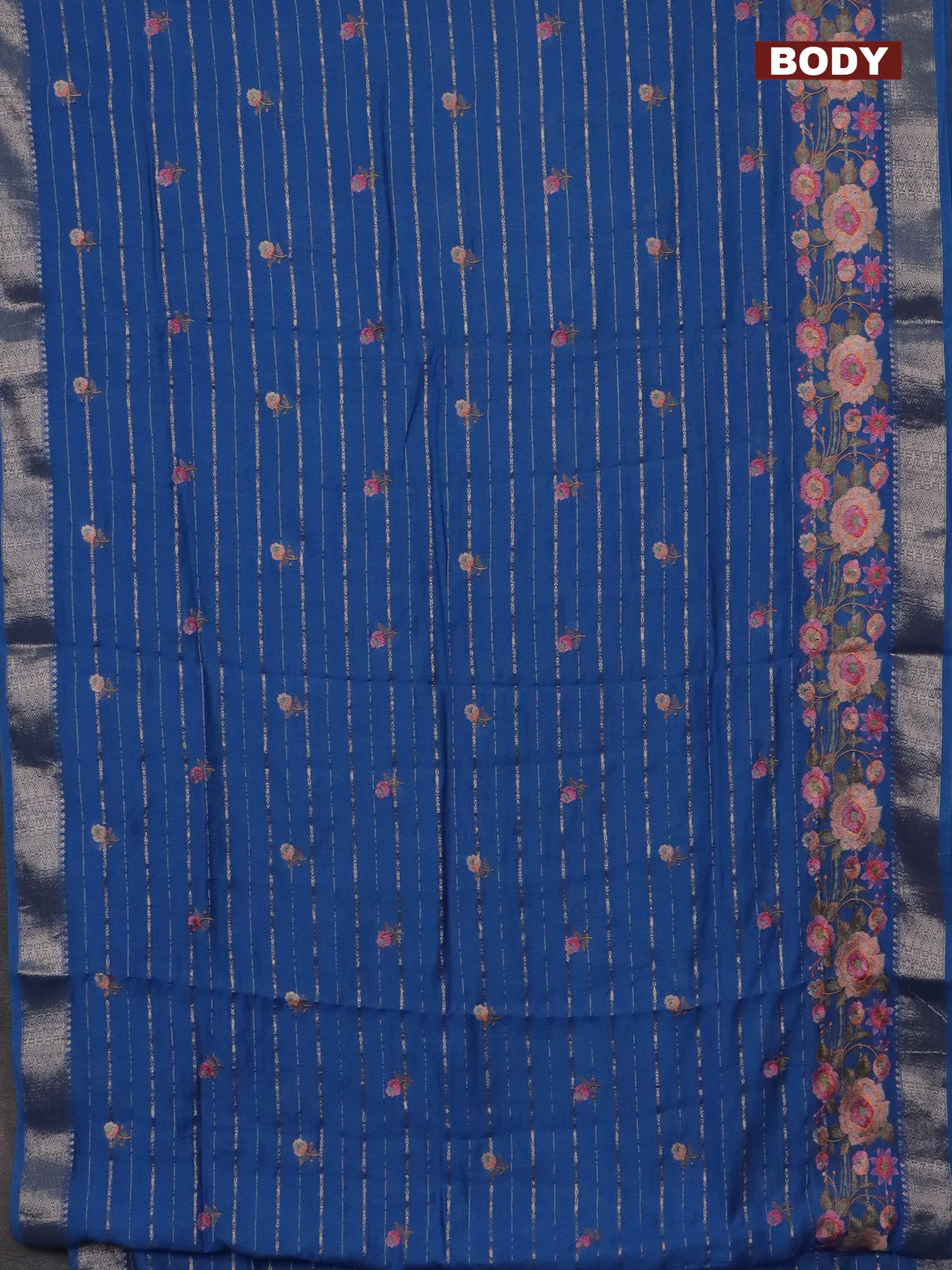 Assam silk saree cs blue with allover zari weaves & floral embroidery work buttas and zari woven border - Image 2
