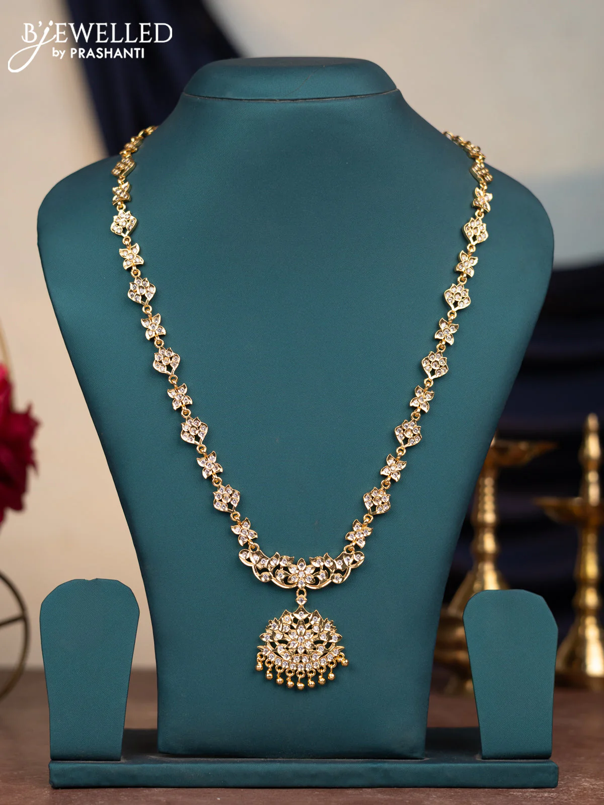 Attigai haram with cz stones and hangings in gold finish without earrings
