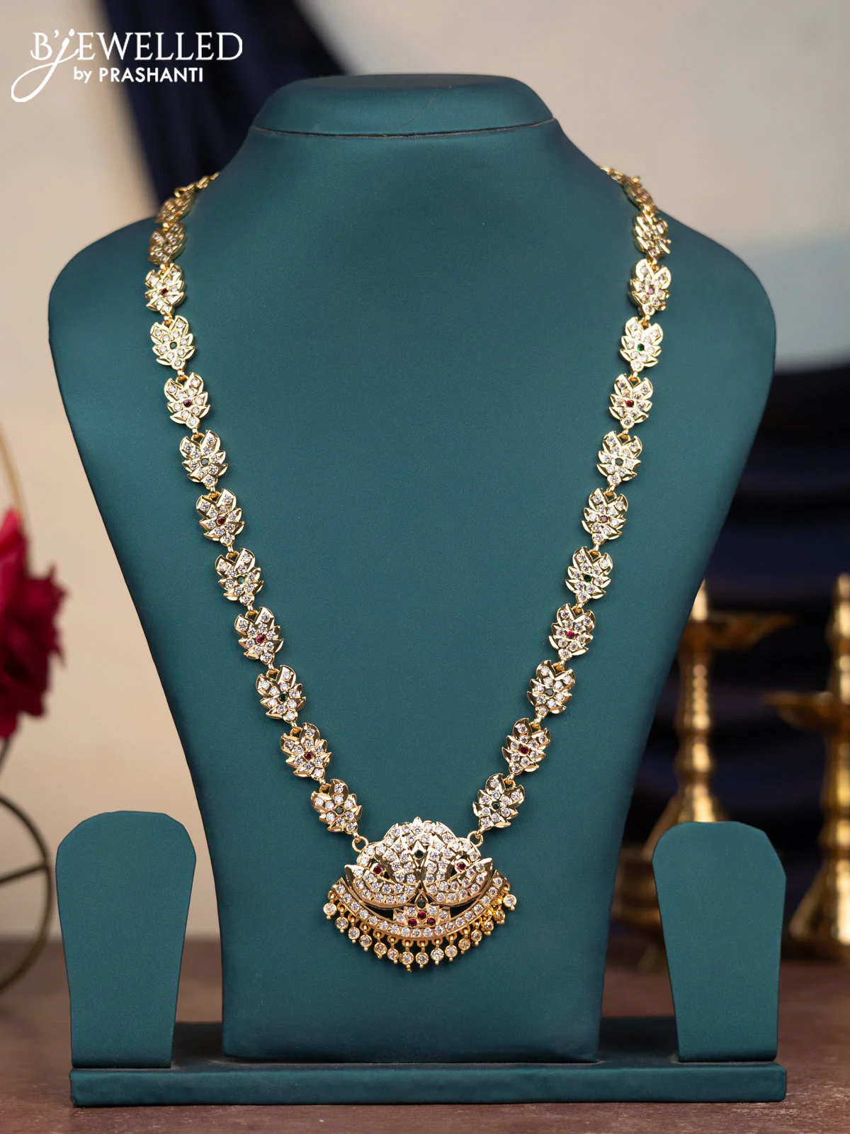 Attigai haram with kemp & cz stones and hangings in gold finish without earrings