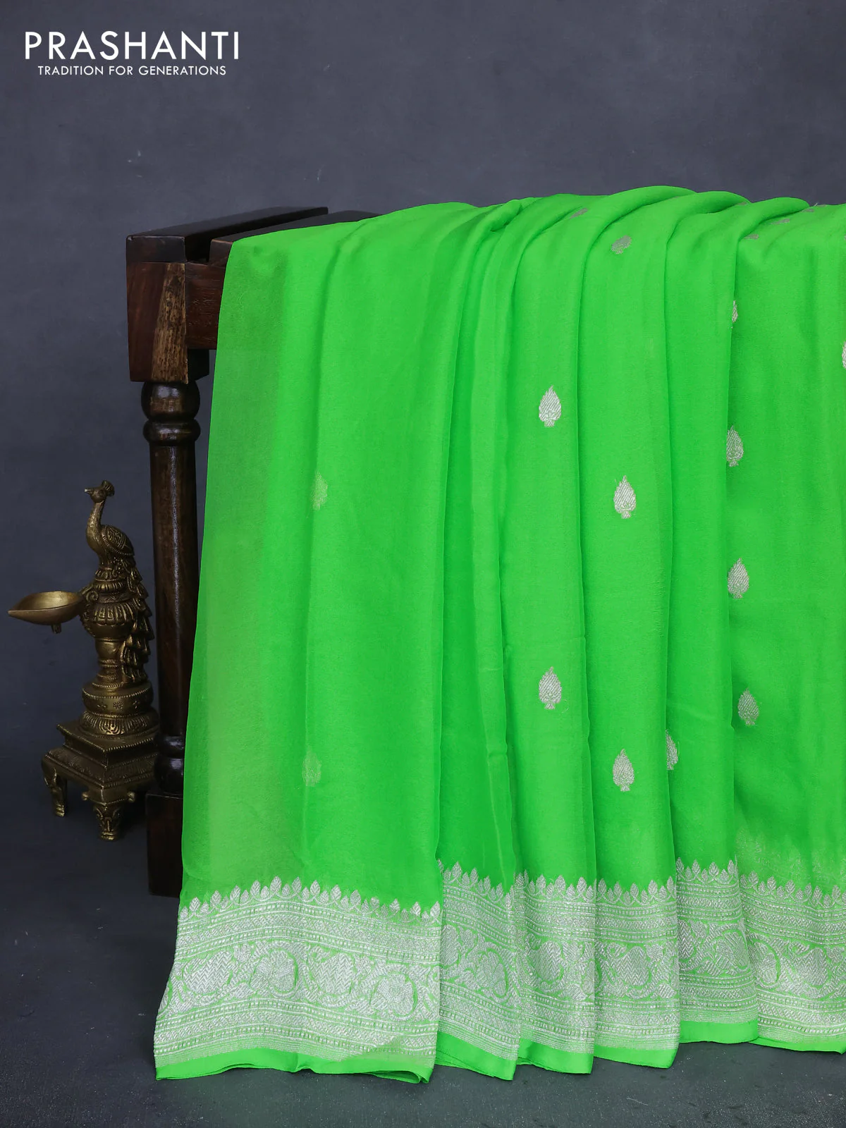 Banarasi chiffon silk saree light green with silver zari woven buttas and silver zari woven border