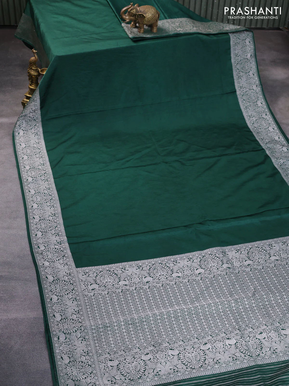 Banarasi crush crepe saree dark green with plain body and silver zari woven border - Image 2