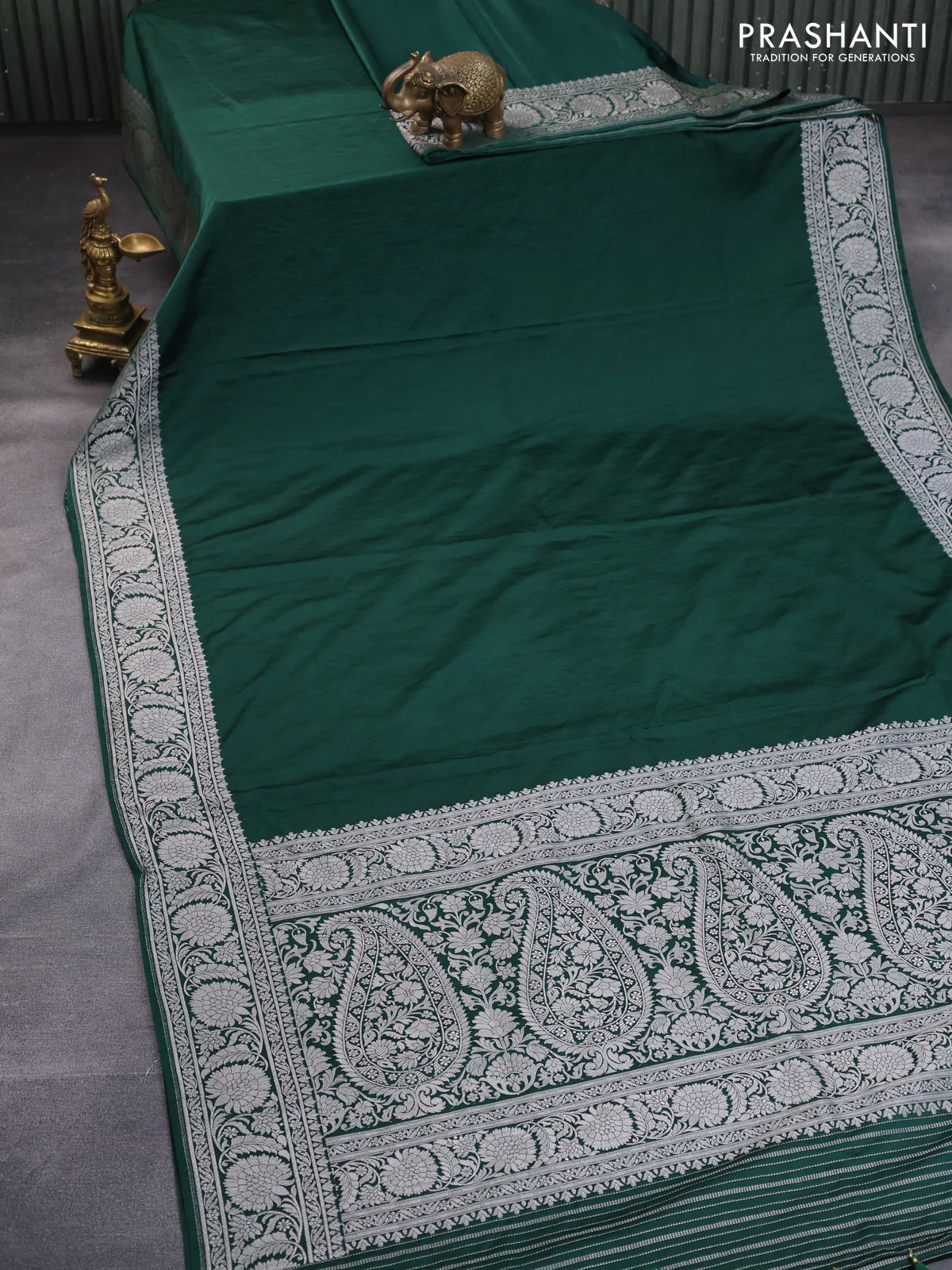 Banarasi crush crepe saree dark green with plain body and silver zari woven floral border - Image 2