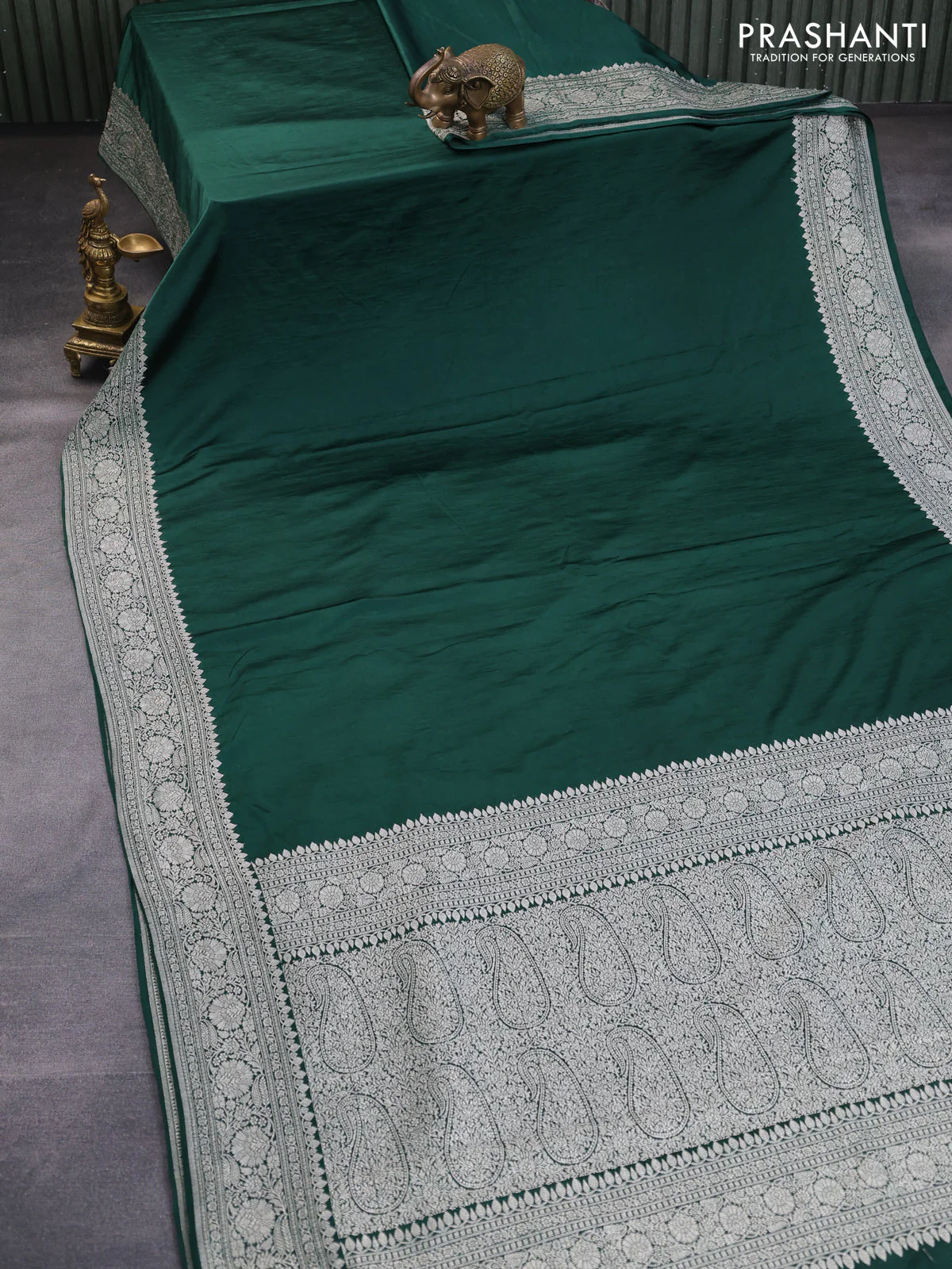 Banarasi crush crepe saree dark green with plain body and zari woven border - Image 2