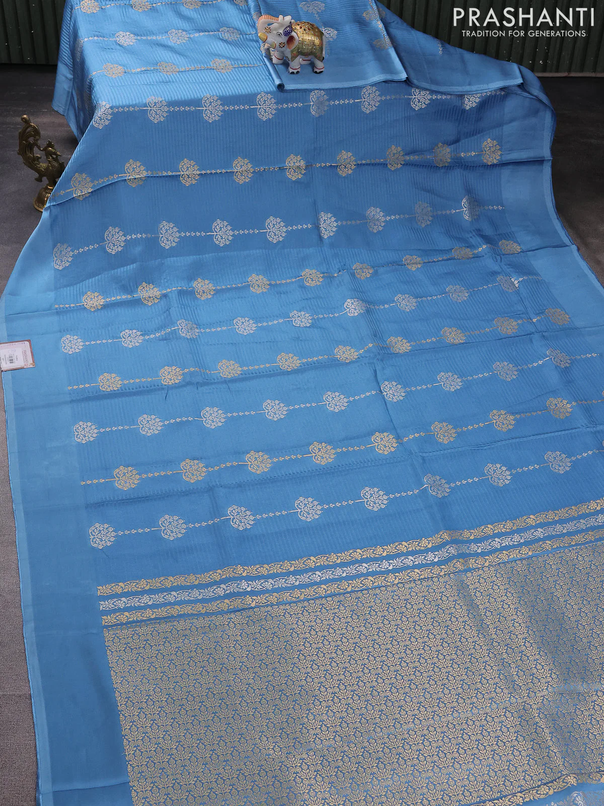Banarasi mushru silk saree light blue with allover stripes pattern & zari buttas and satin border - Image 2