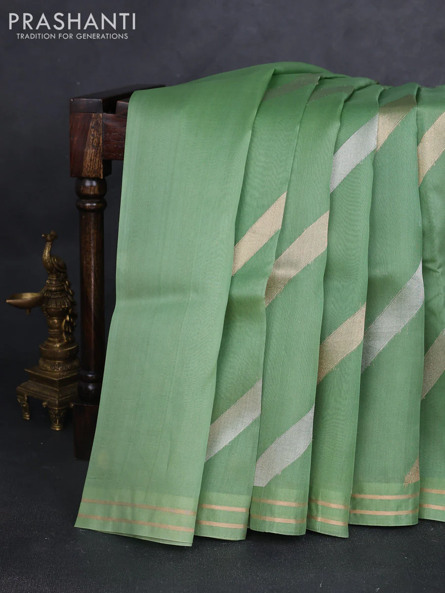 Banarasi organza silk saree green shade with allover silver & gold zari weaves and zari woven border