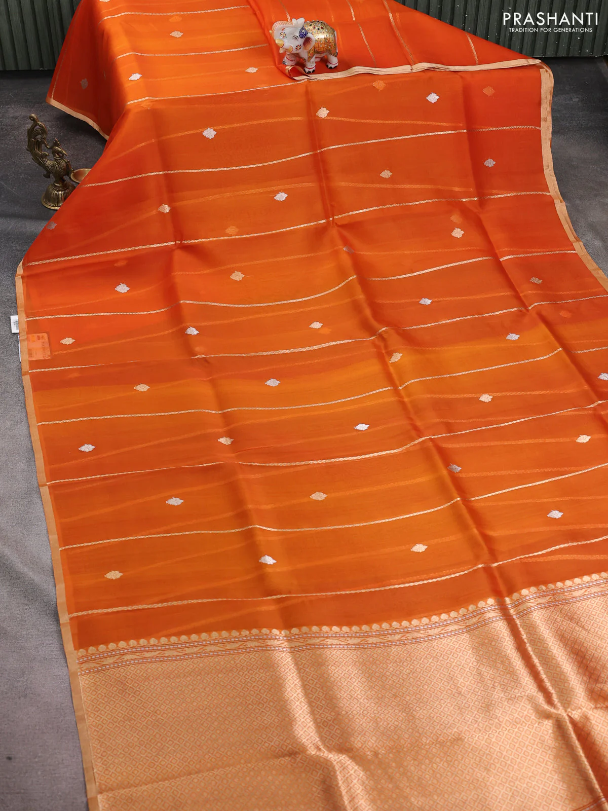 Banarasi organza silk saree orange with allover zari stripes pattern & butas and zari woven border - Image 2