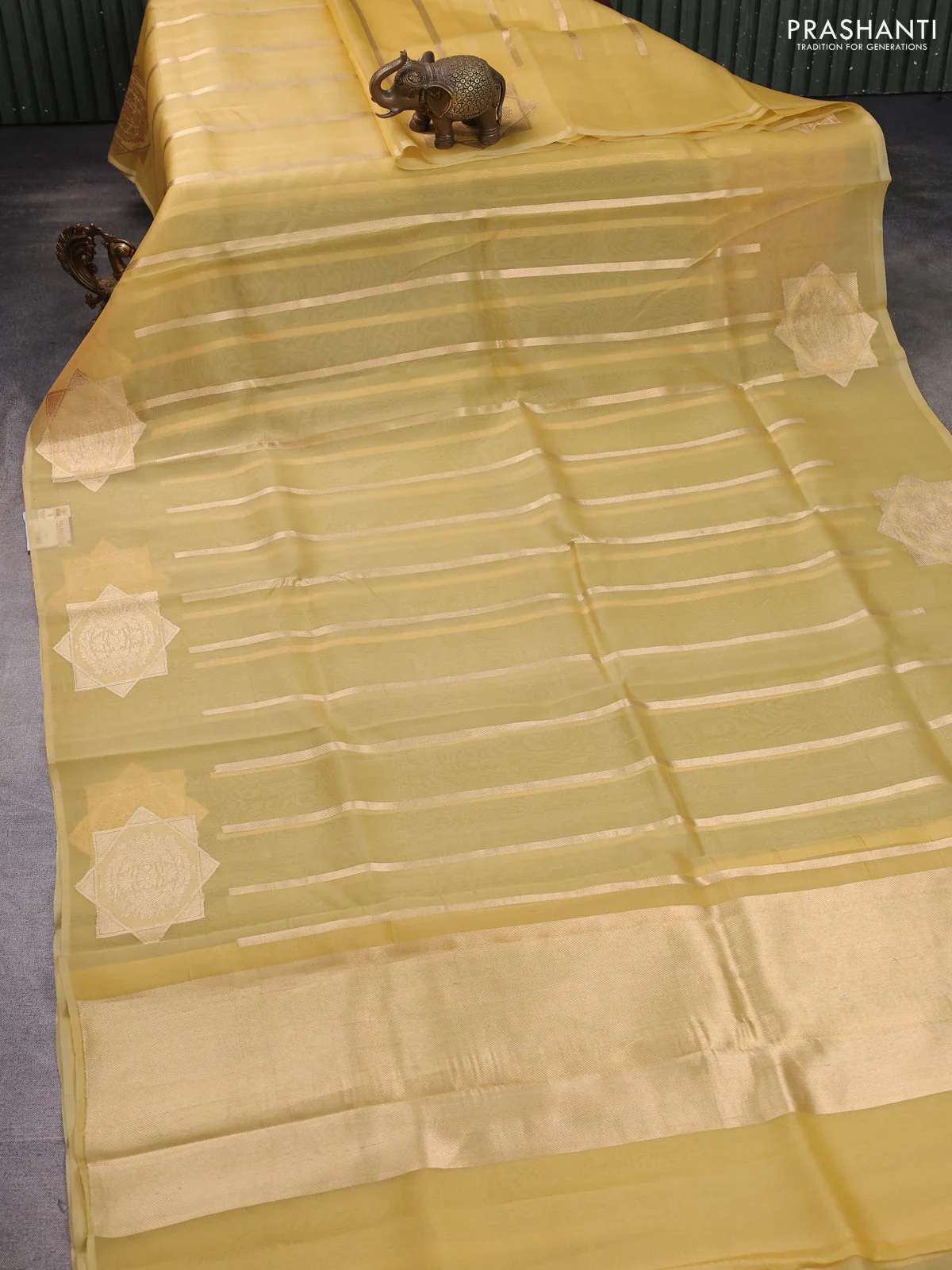 Banarasi organza silk saree pale yellow with allover zari stripes pattern and zari woven butta border - Image 2