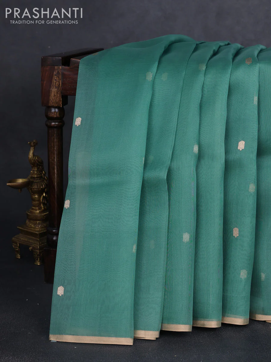 Banarasi organza silk saree pastel green with allover zari woven buttas and zari woven border