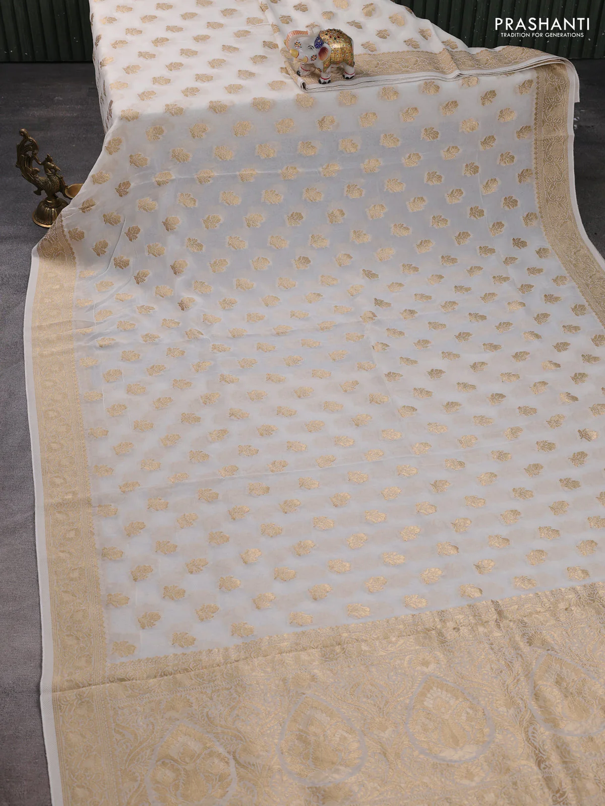 Banarasi semi georgette saree off white with allover floral zari buttas and zari woven border - Image 2