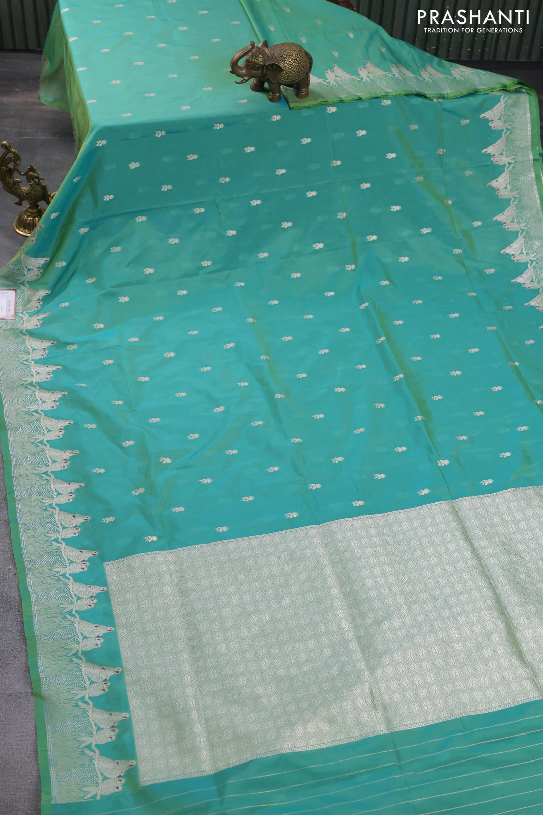 Banarasi semi katan silk saree dual shade of teal bluish green with allover zari woven buttas and parrot design zari woven border - Image 2