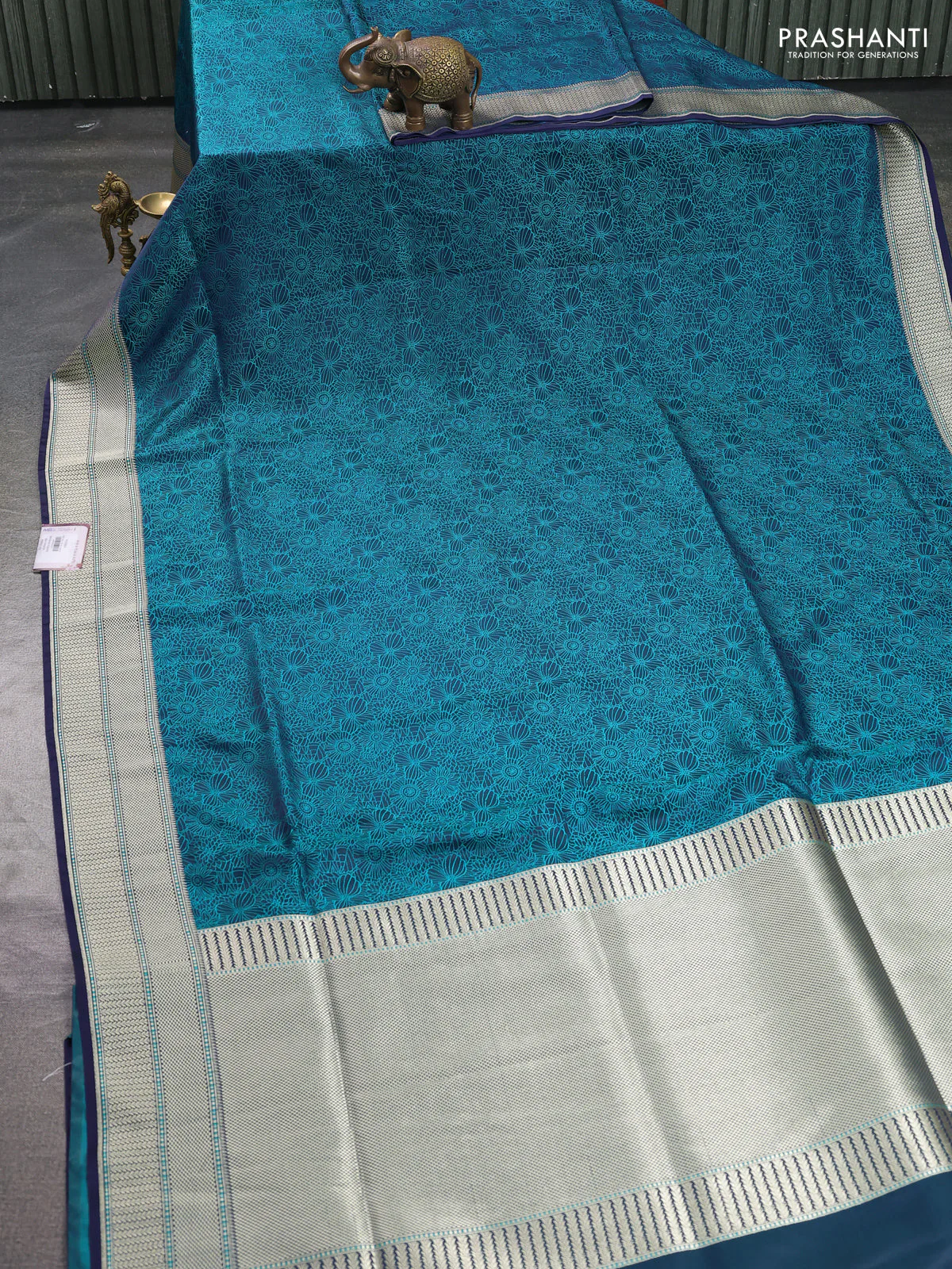 Banarasi semi katan silk saree navy blue with allover floral self emboss and zari woven border - Image 2