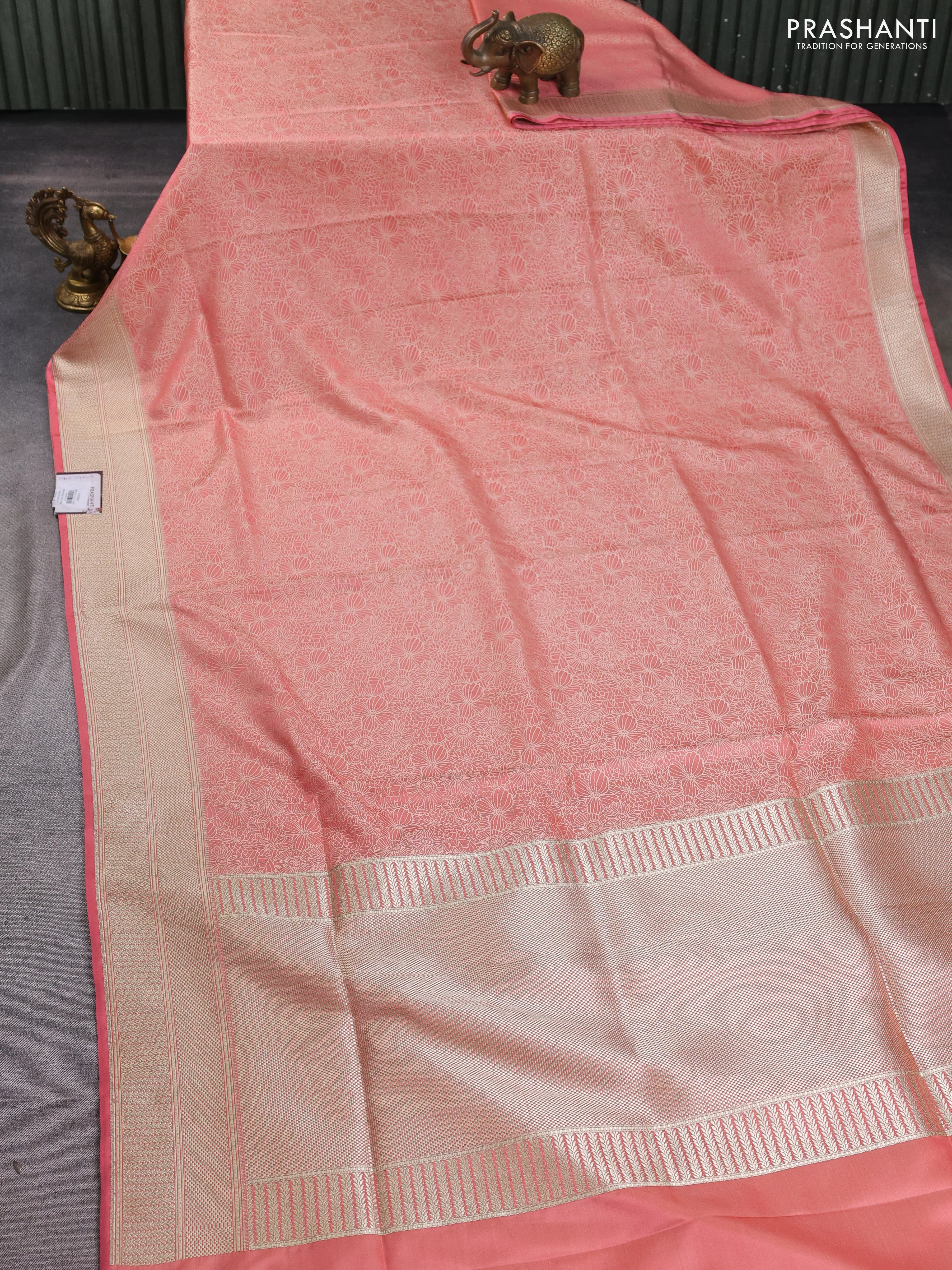 Banarasi semi katan silk saree peach shade with allover floral self emboss and zari woven border - Image 2
