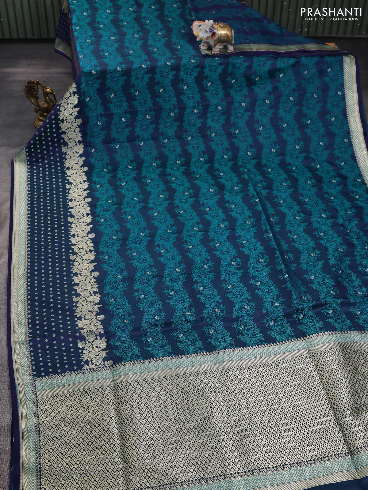 Banarasi semi katan silk saree peacock blue with allover floral self emboss & zari woven buttas and zari woven border - Image 2