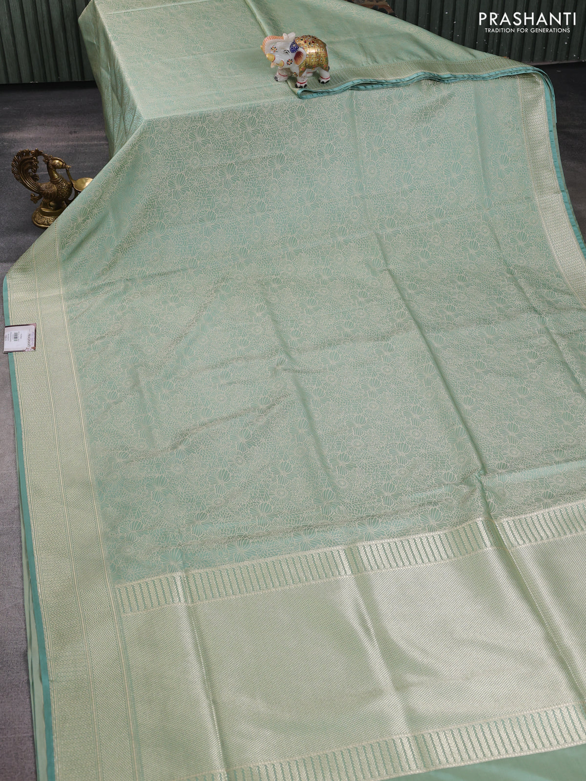Banarasi semi katan silk saree teal shade with allover floral self emboss and zari woven border - Image 2