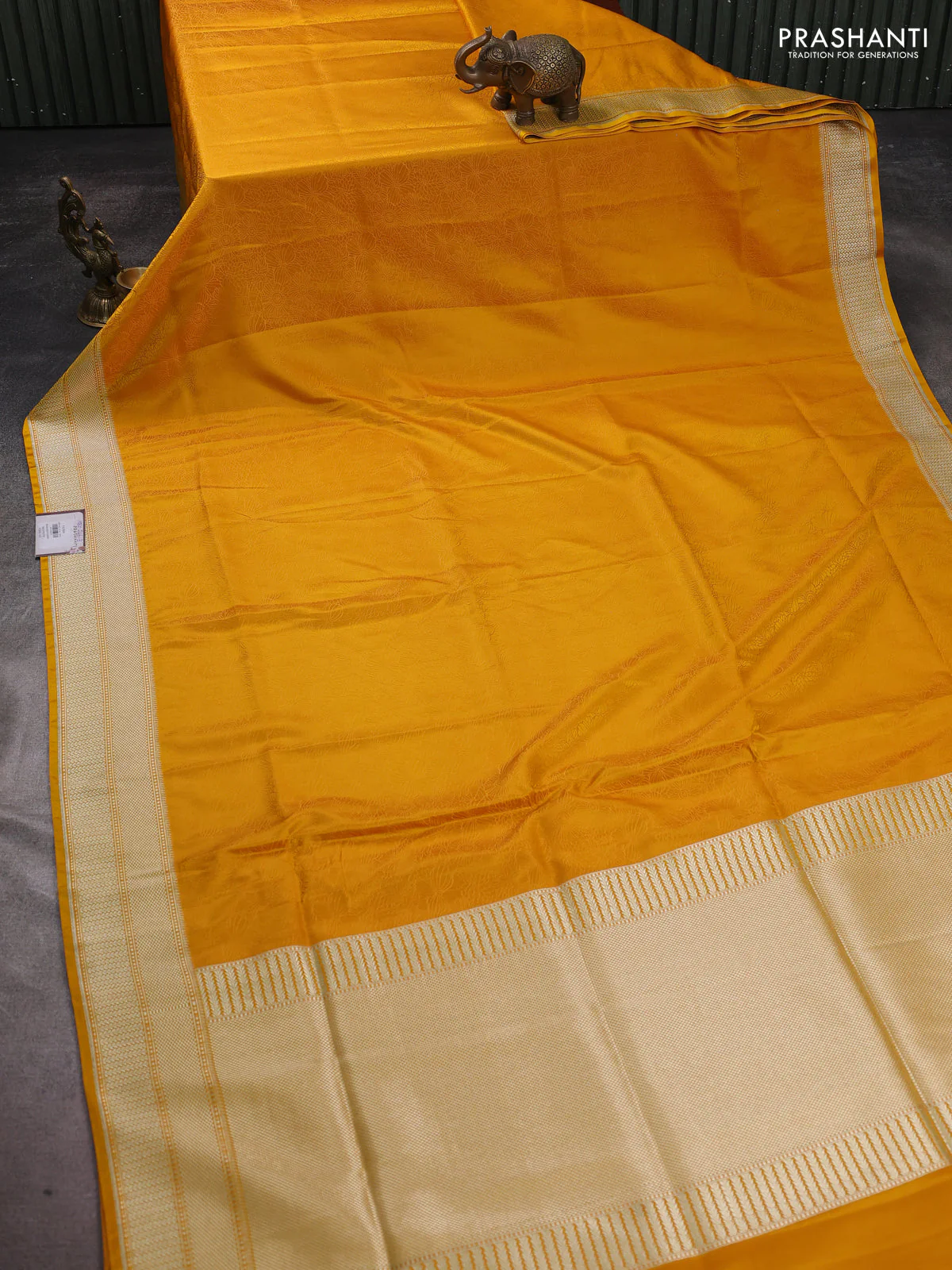 Banarasi semi katan silk saree yellow with allover floral self emboss and zari woven border - Image 2
