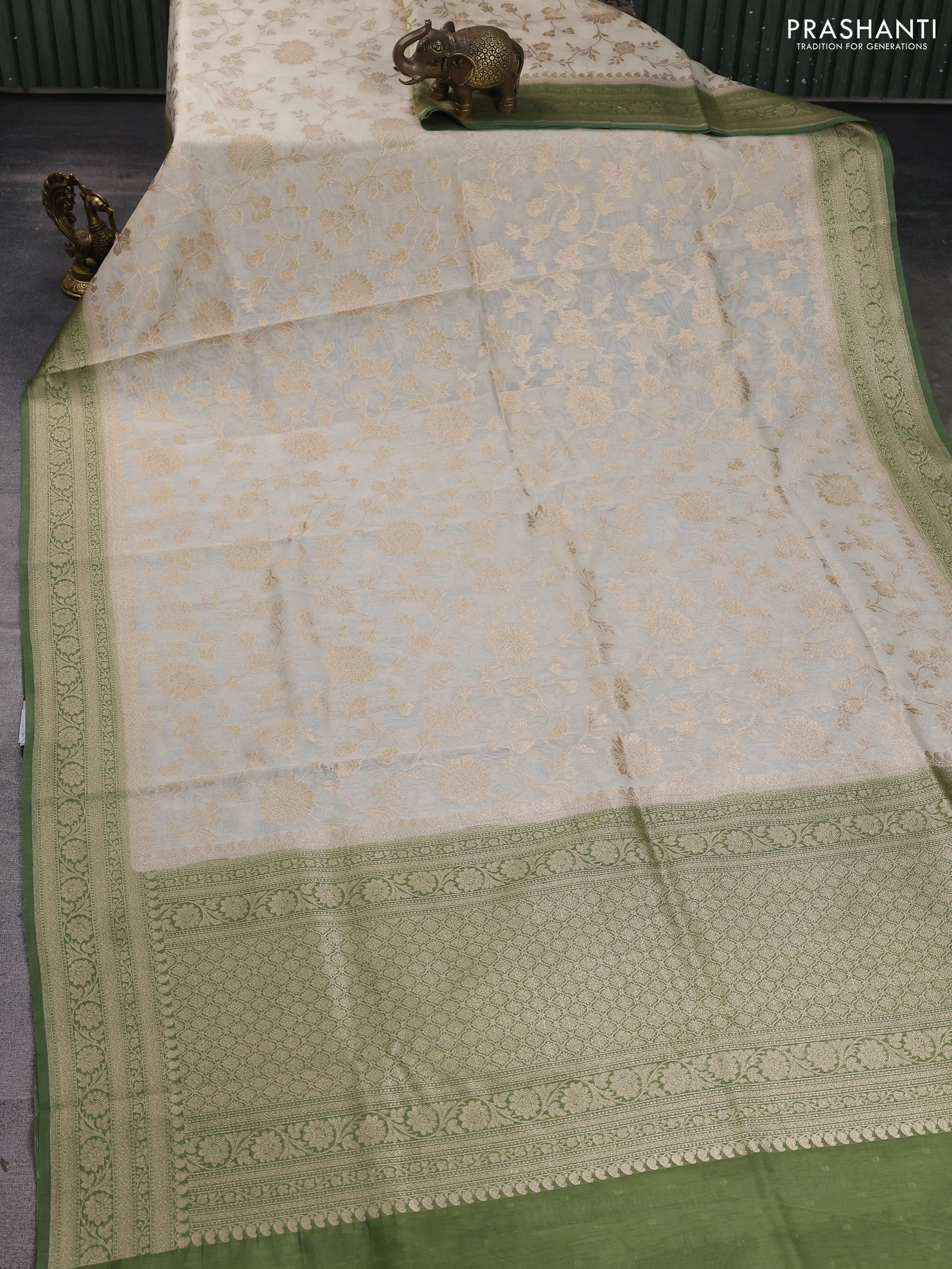 Banarasi silk cotton saree cream and mehendi green with allover floral zari weaves and zari woven border - Image 2