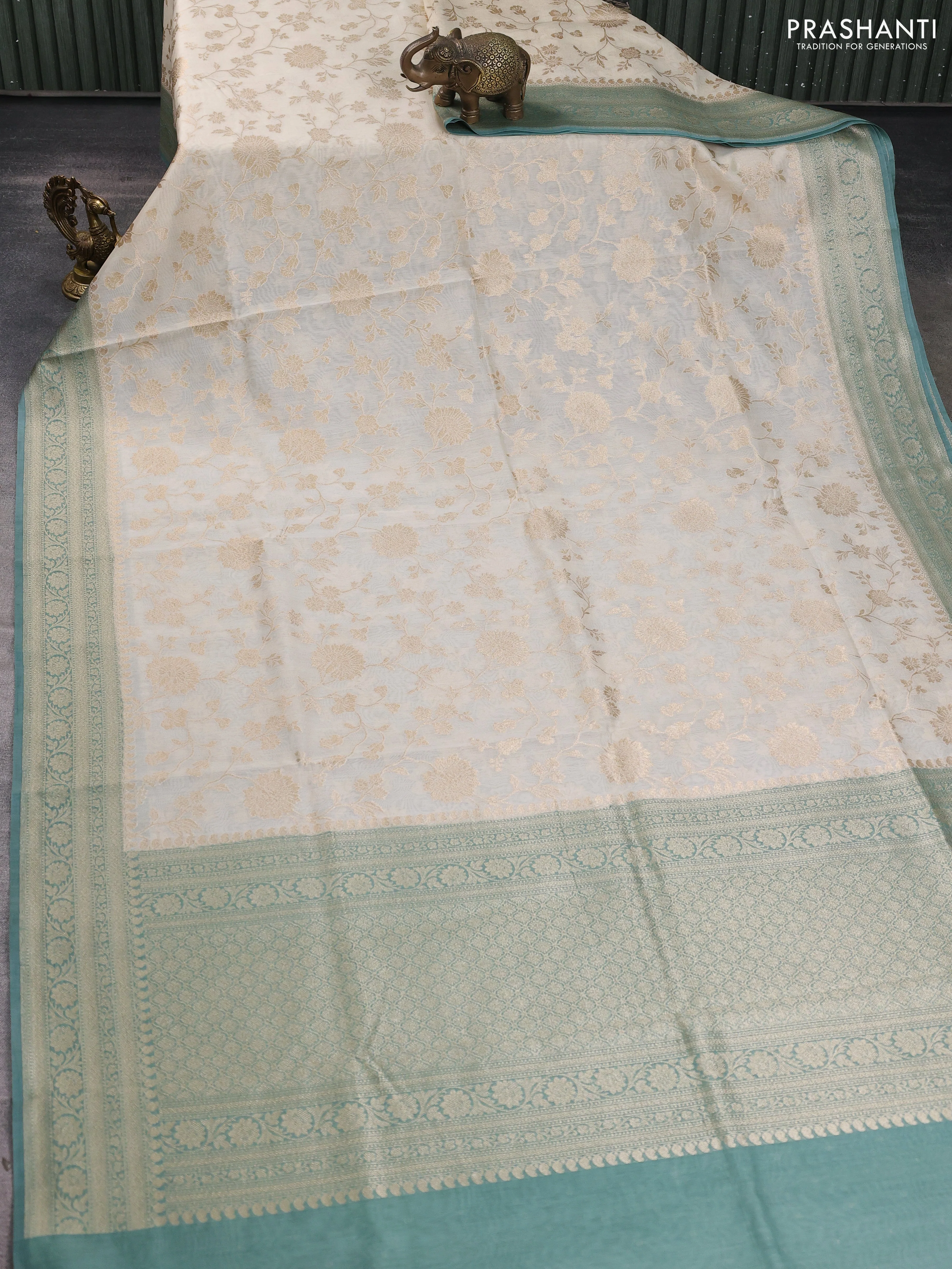Banarasi silk cotton saree cream and pastel green shade with allover floral zari weaves and zari woven border - Image 2