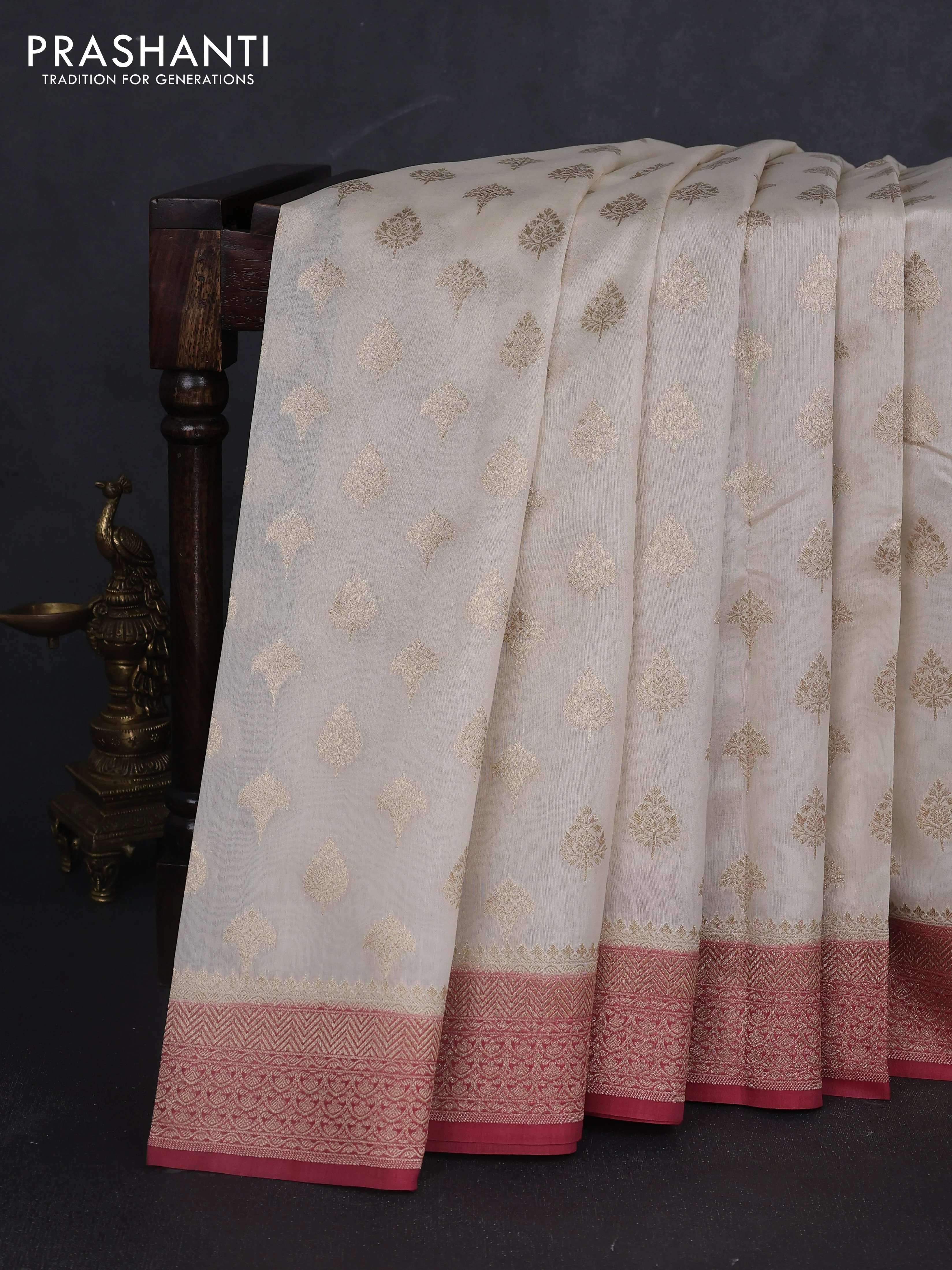 Banarasi silk cotton saree cream and peach pink with allover thread & zari woven buttas and woven border