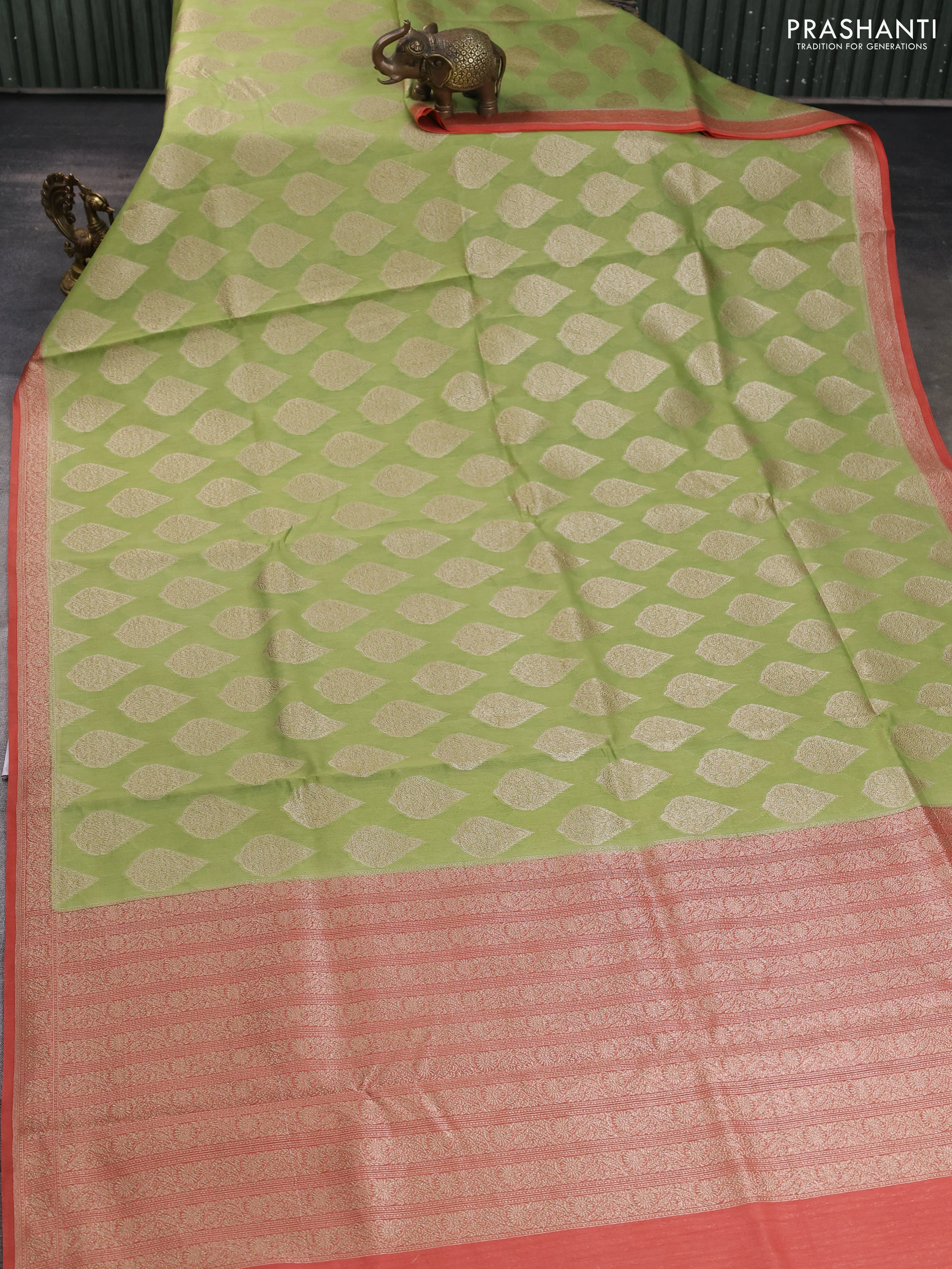 Banarasi silk cotton saree light green and peach pink with allover zari woven buttas and zari woven border - Image 2
