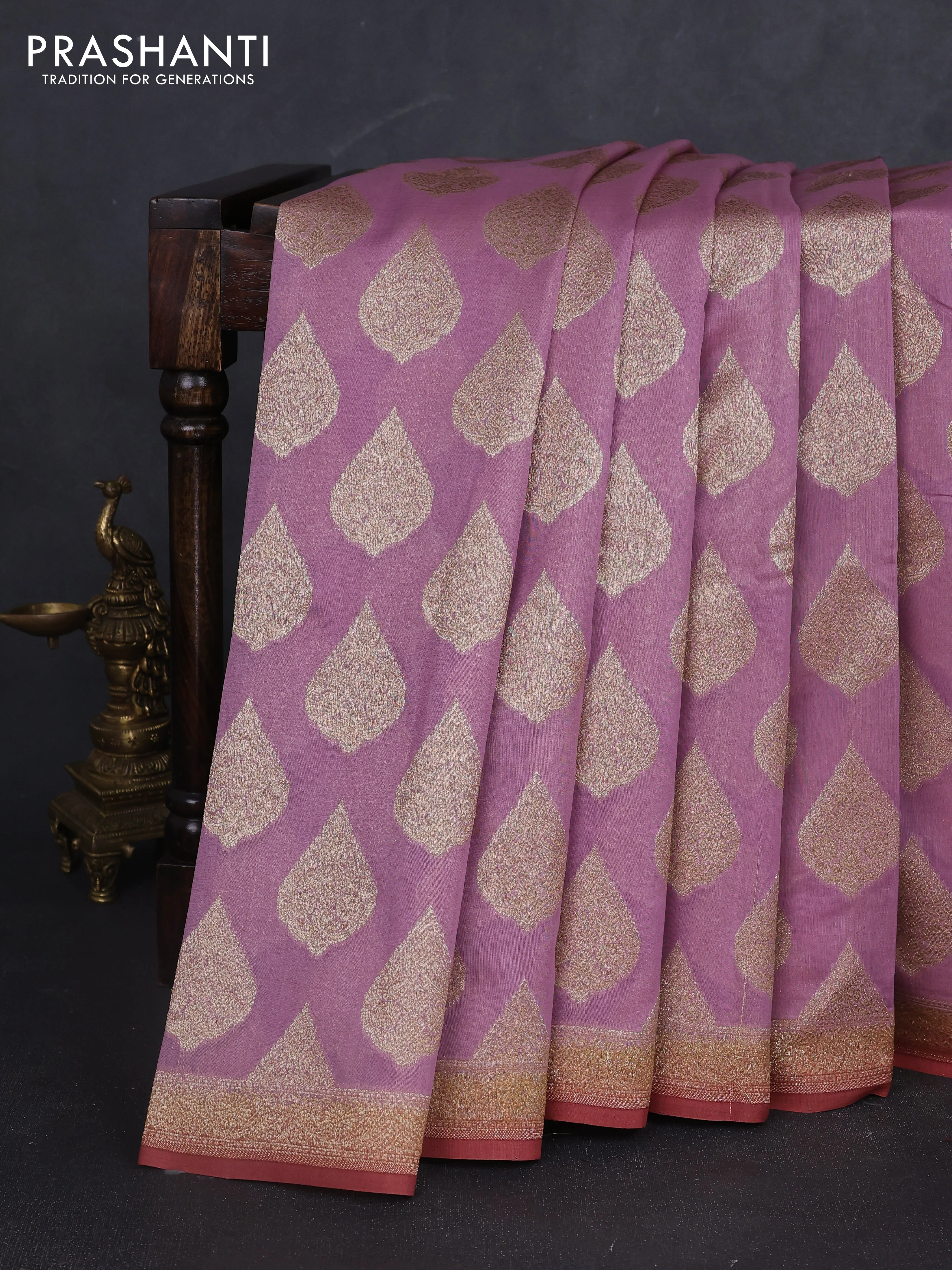 Banarasi silk cotton saree pastel pink and rust shade with allover zari woven buttas and zari woven border