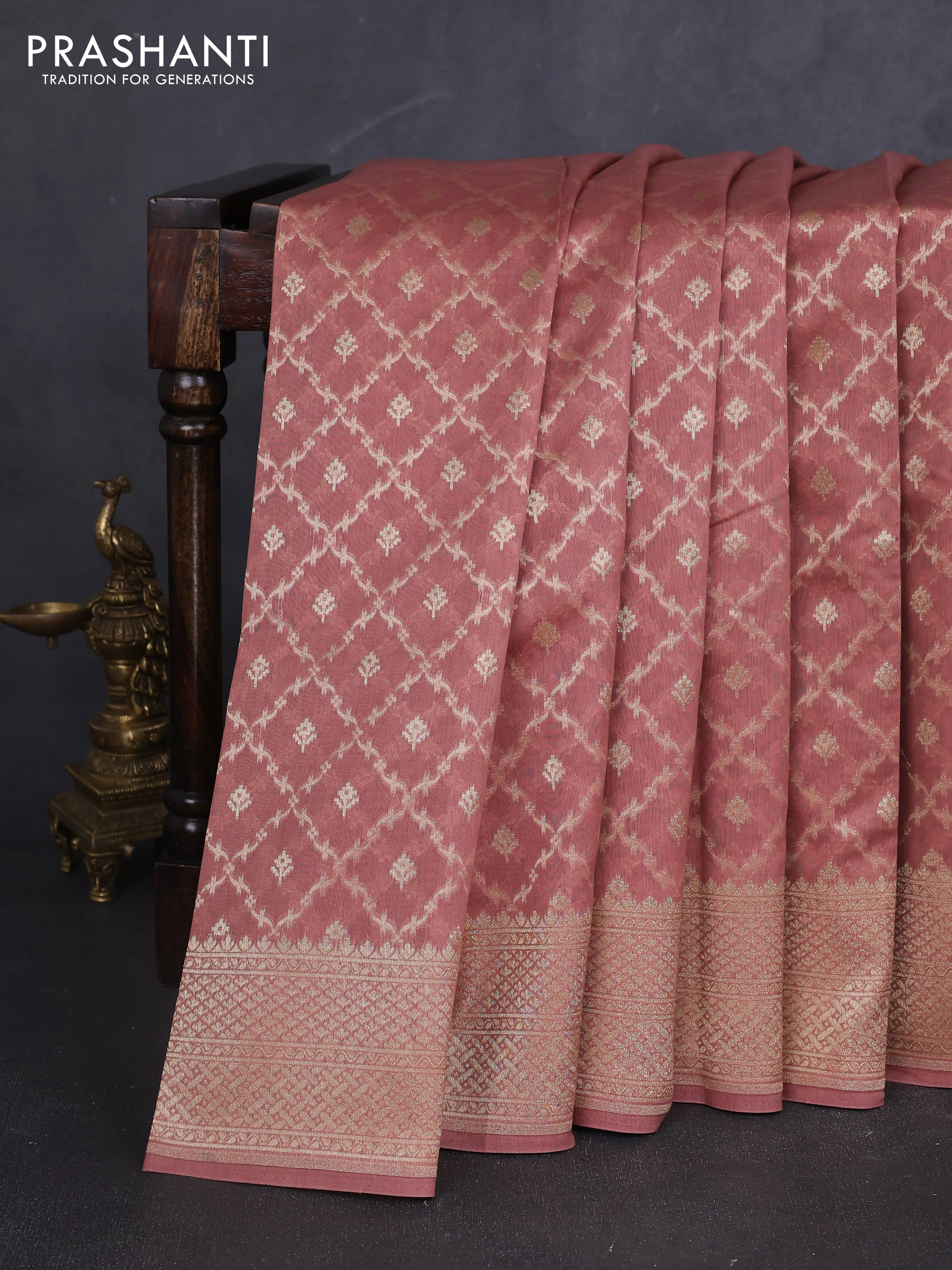 Banarasi silk cotton saree peach shade with allover zari woven buttas and zari woven border