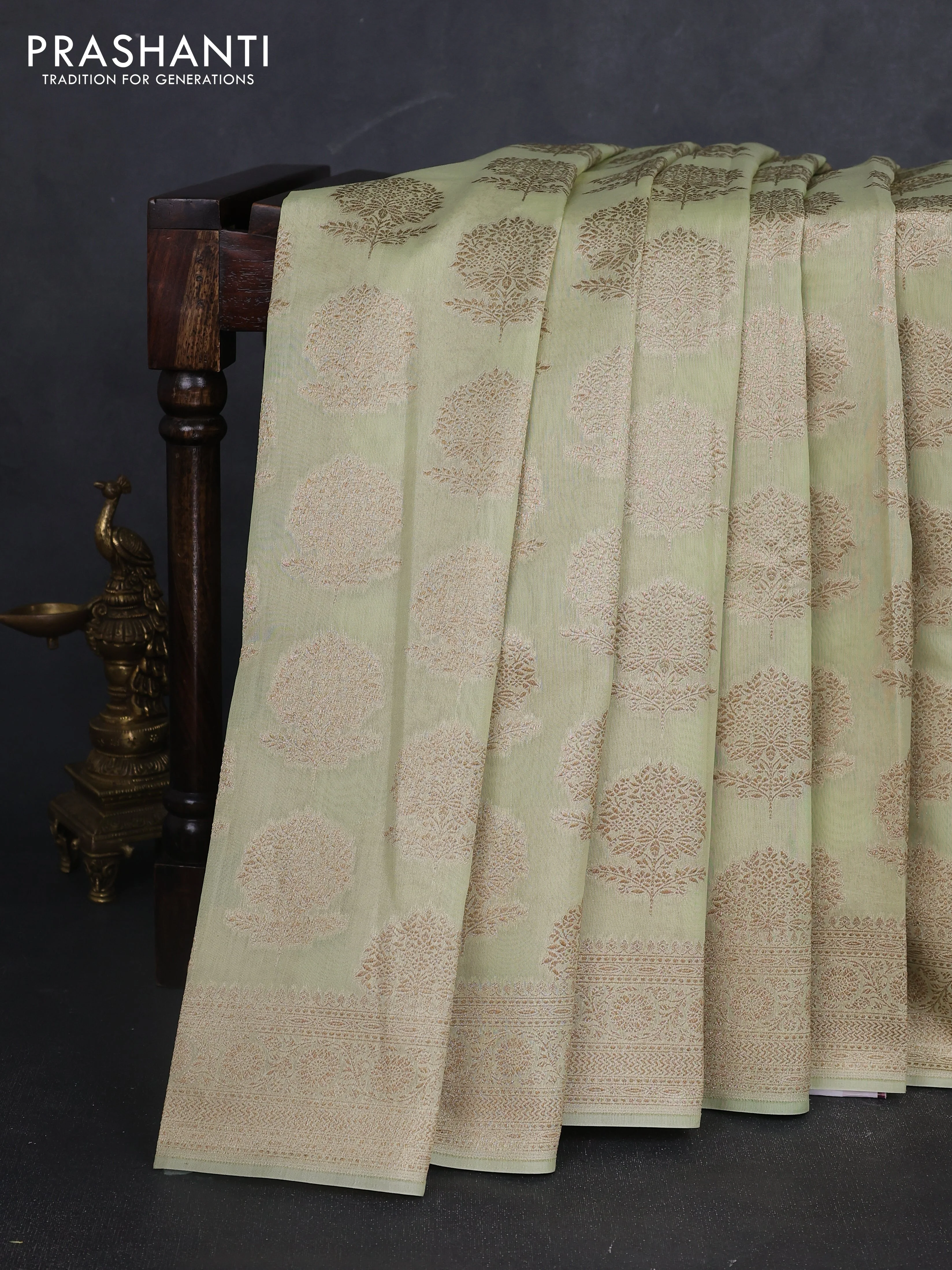 Banarasi silk cotton saree pista green with woven buttas and zari woven border