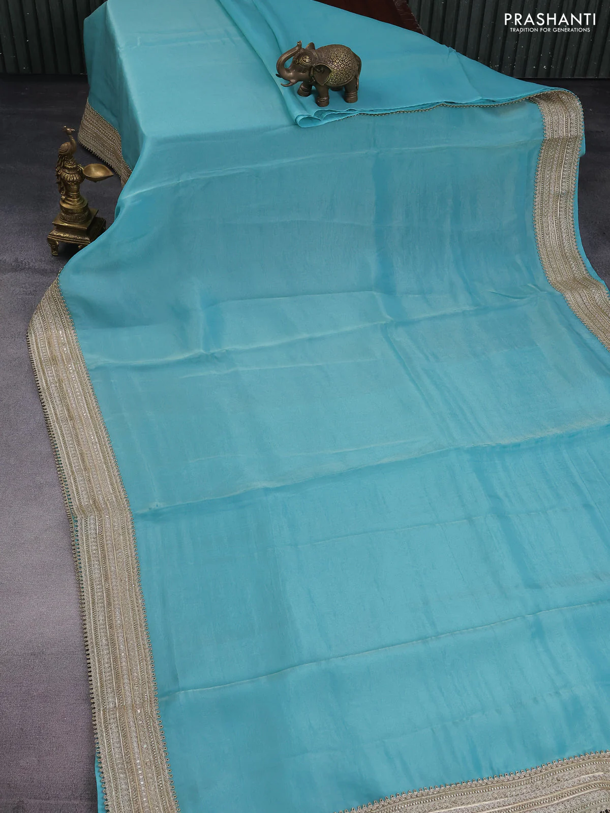 Banarasi tissue saree teal blue with plain body and lace work border - Image 2