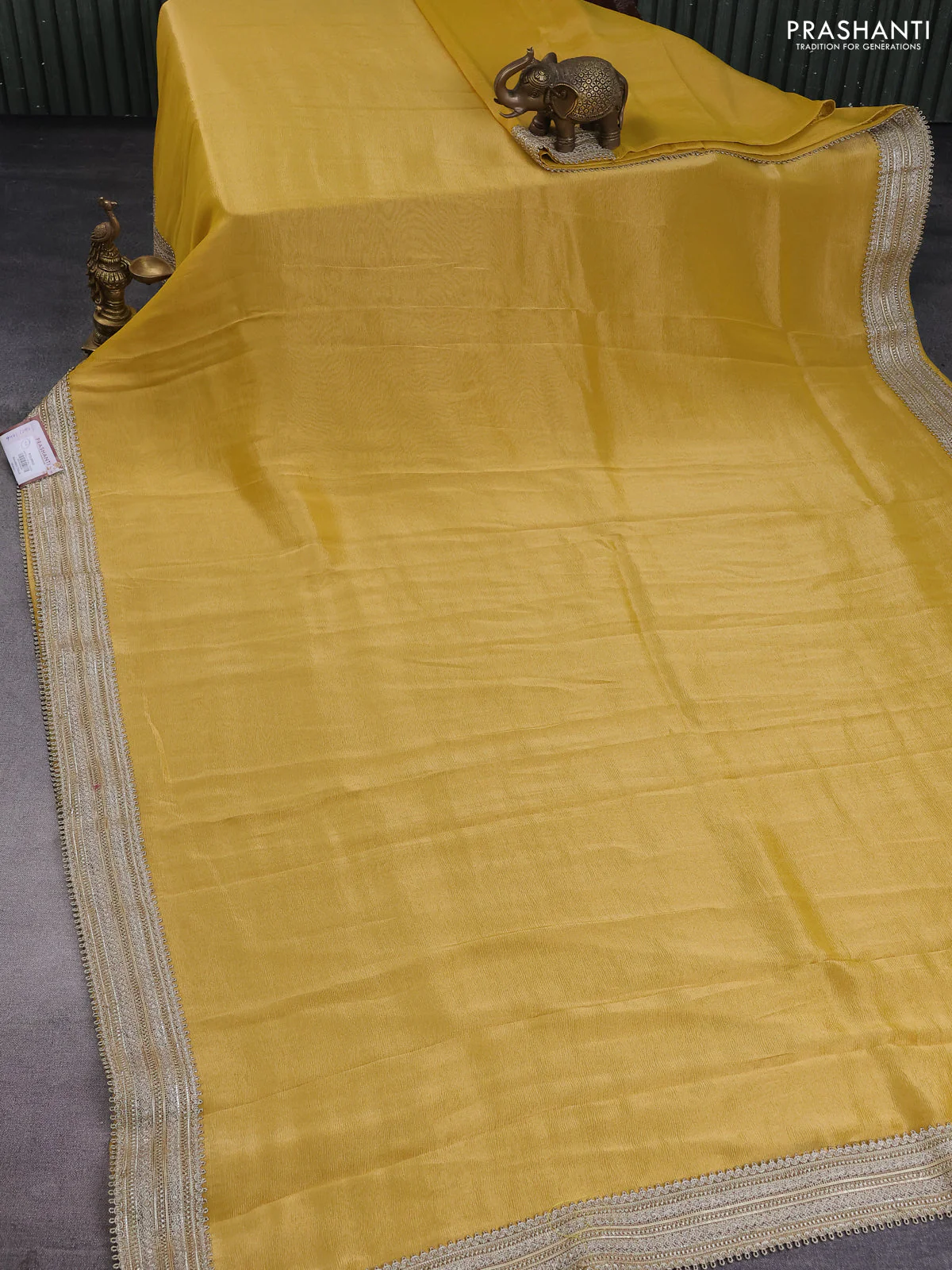 Banarasi tissue saree yellow with plain body and lace work border - Image 2