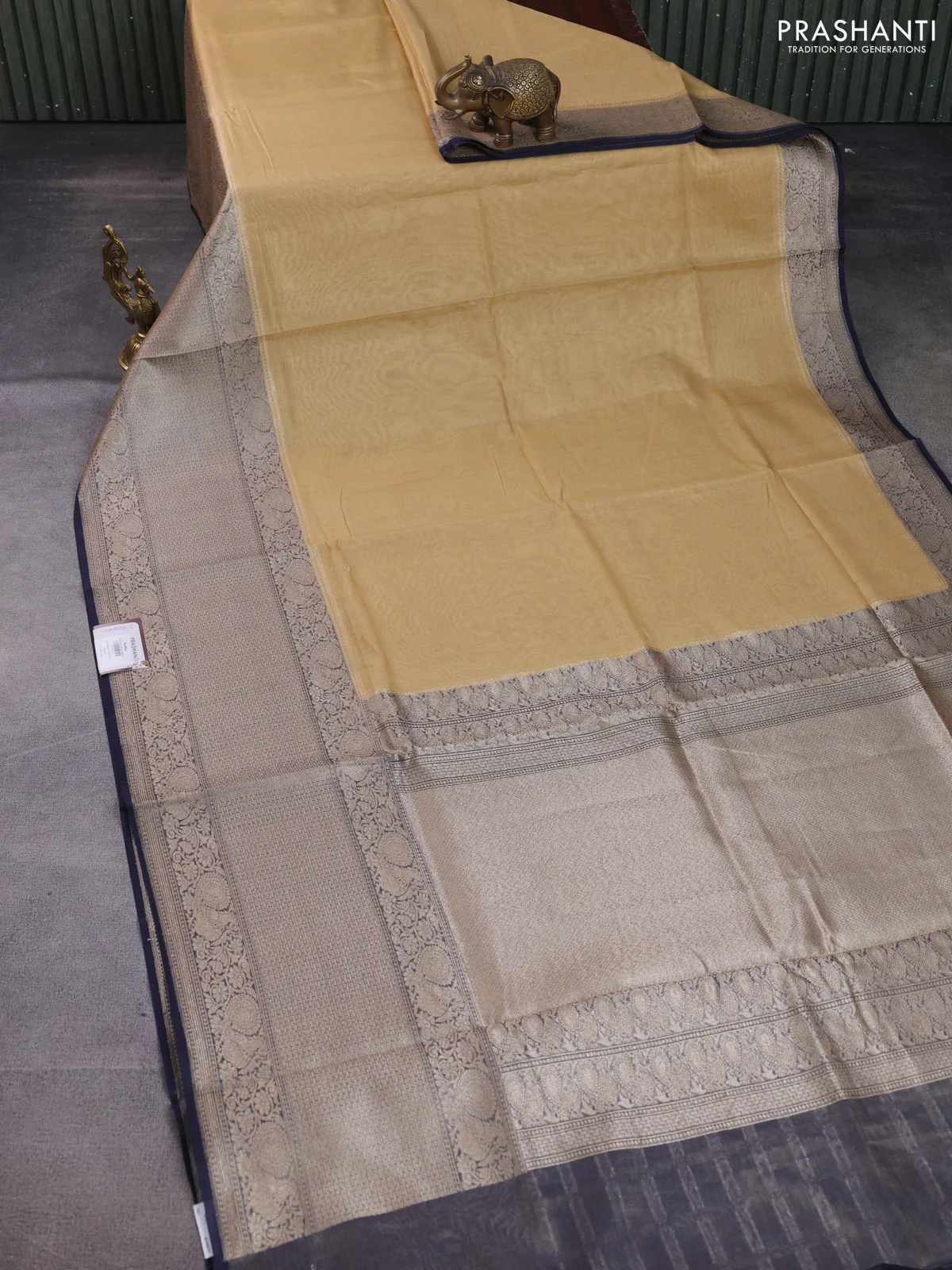 Banarasi tissue silk cotton saree sandal and navy blue with plain body and long woven border - Image 2