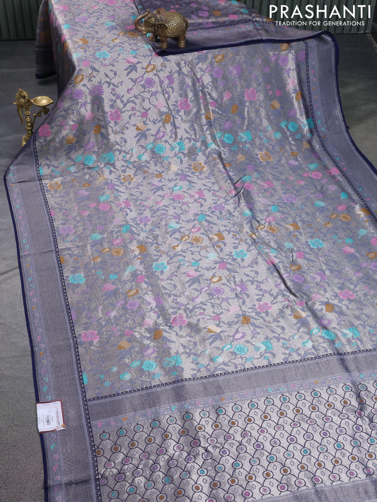Banarasi tissue silk saree navy blue with allover thread woven floral weaves and silver zari woven border - Image 2