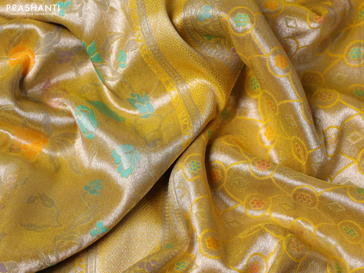 Banarasi tissue silk saree yellow with allover thread woven floral weaves and silver zari woven border - Image 3