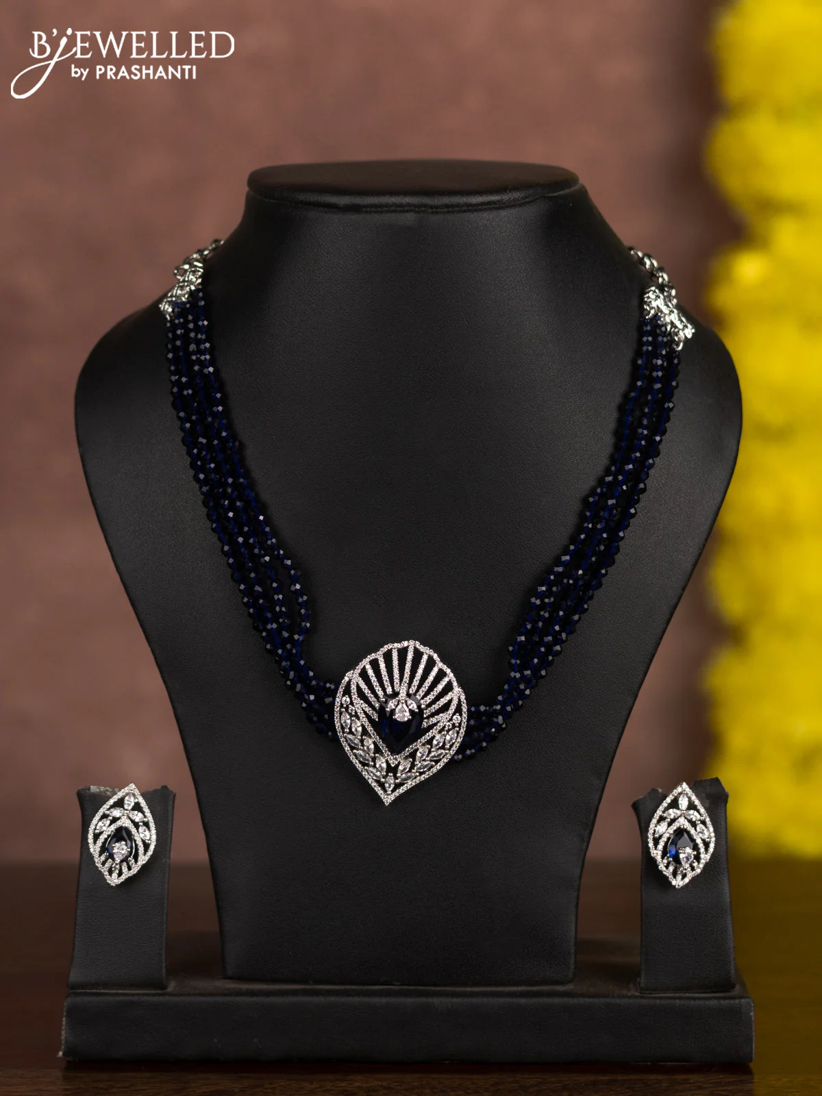 Beaded blue choker with sapphire and cz stones in zircon finish