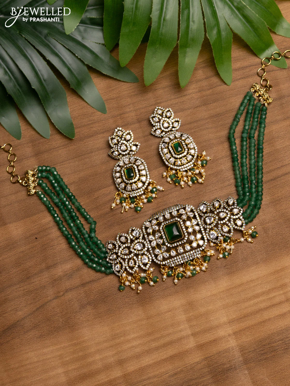 Beaded green choker with emerald & kundan stones and beads hanging in victorian finish
