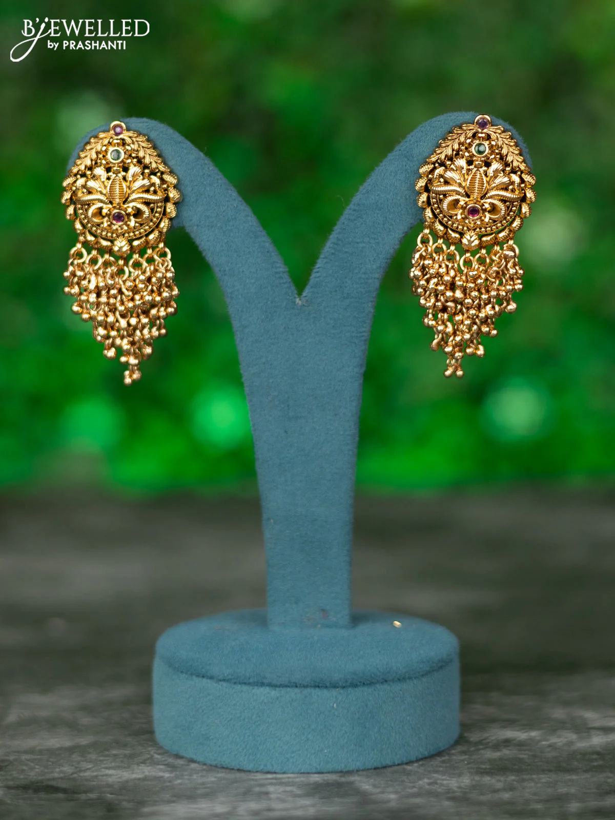 Black thread necklace with kemp stones and golden beads hanging - Image 2