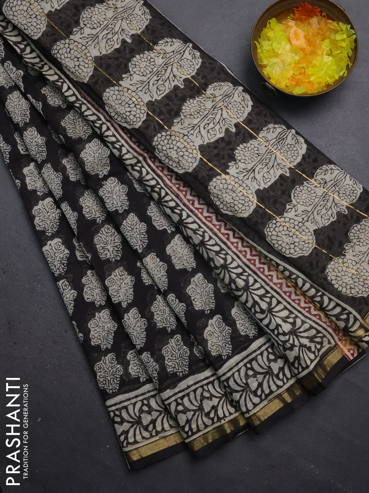 Chanderi bagru saree black with allover floral prints and small zari woven border