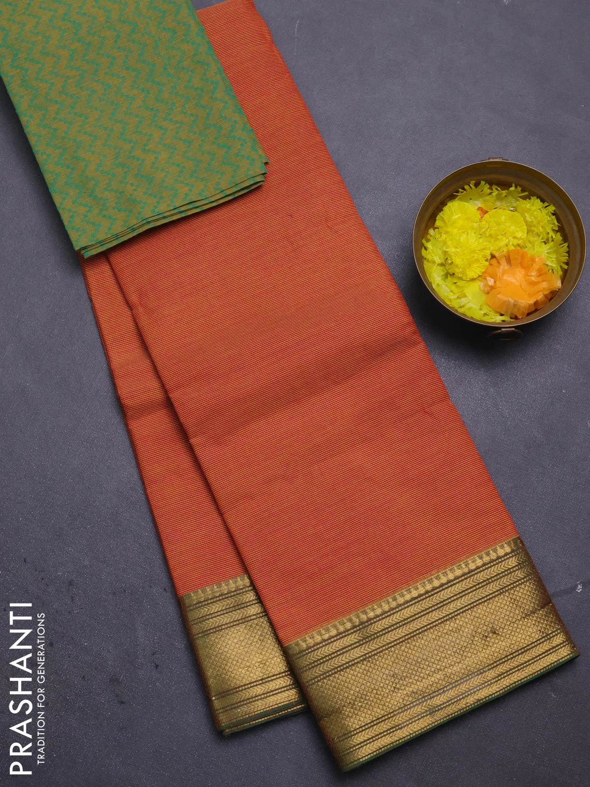 Chettinad cotton saree rust shade and green with allover small checked pattern and zari woven border