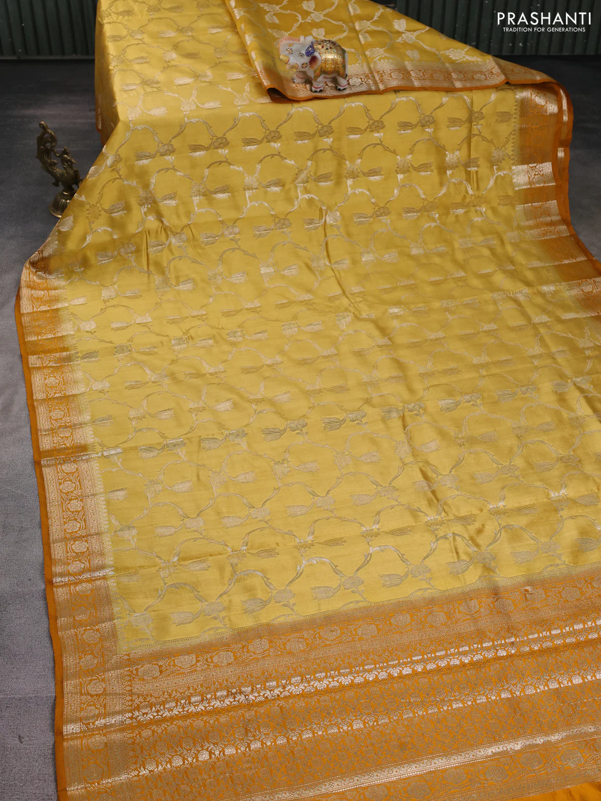 Chiniya silk saree mustard shade and dark mustard with allover floral zari weaves and zari woven border - Image 2