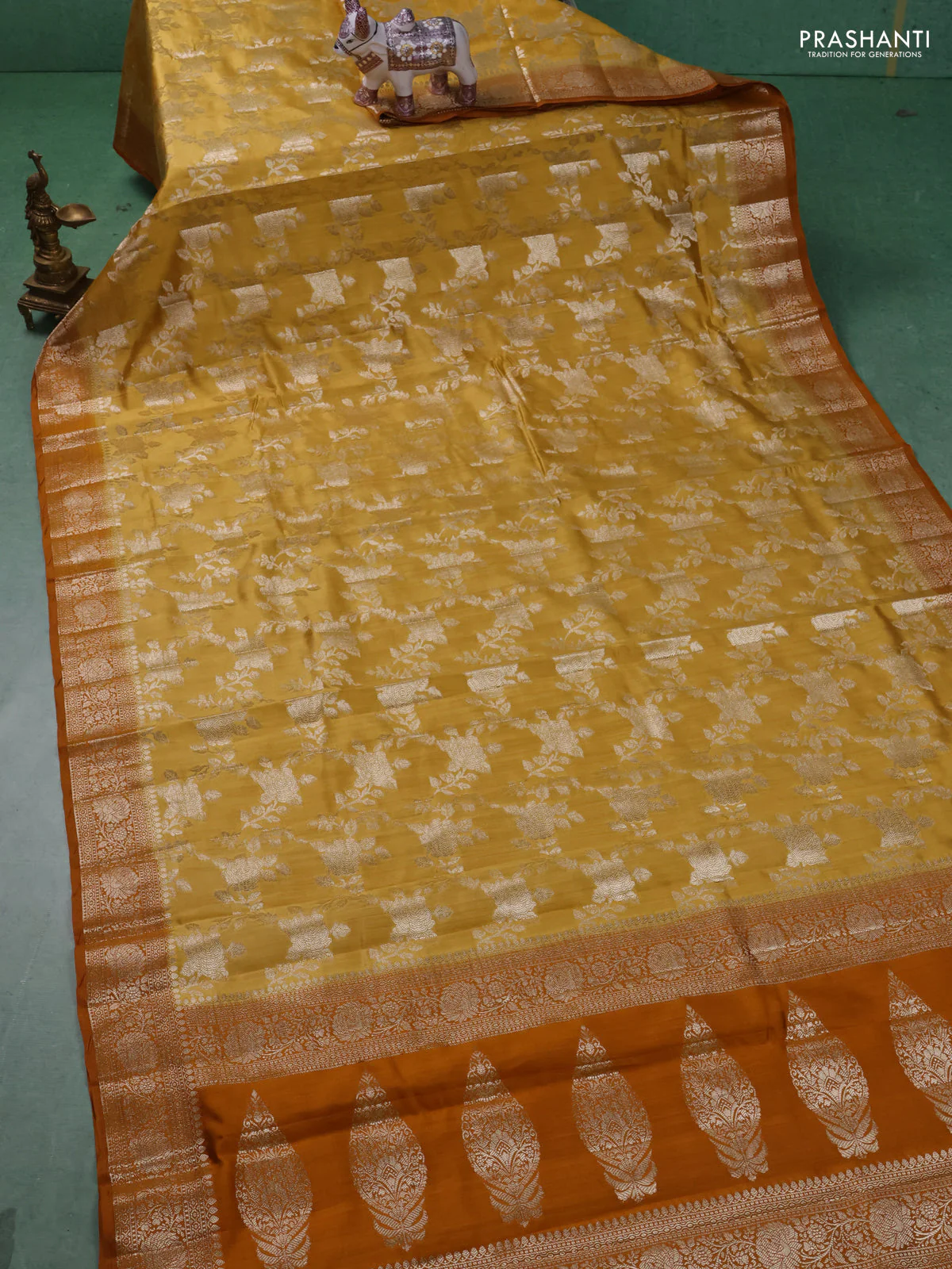 Chiniya silk saree mustard yellow and dark mustard with allover floral zari weaves and zari woven border - Image 2