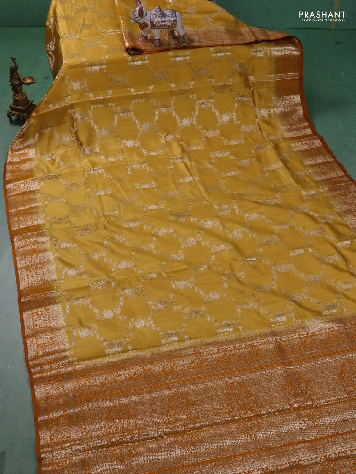 Chiniya silk saree mustard yellow and dark mustard with allover floral zari weaves and zari woven border - Image 2