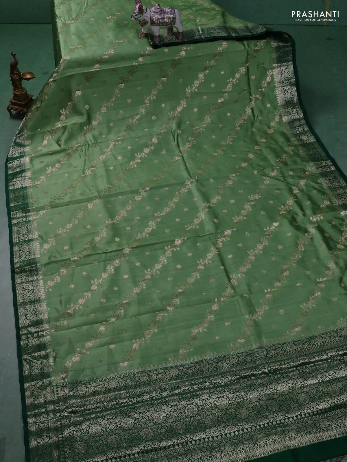 Chiniya silk saree pastel green and dark green with allover zari weaves and zari woven border - Image 2