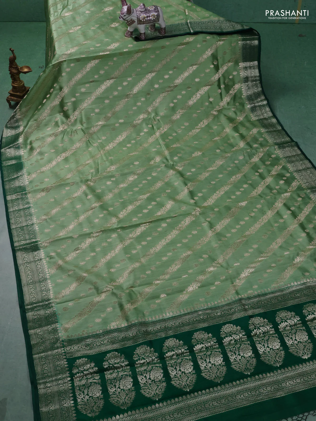 Chiniya silk saree pastel green and dark green with allover zari weaves and zari woven border - Image 2